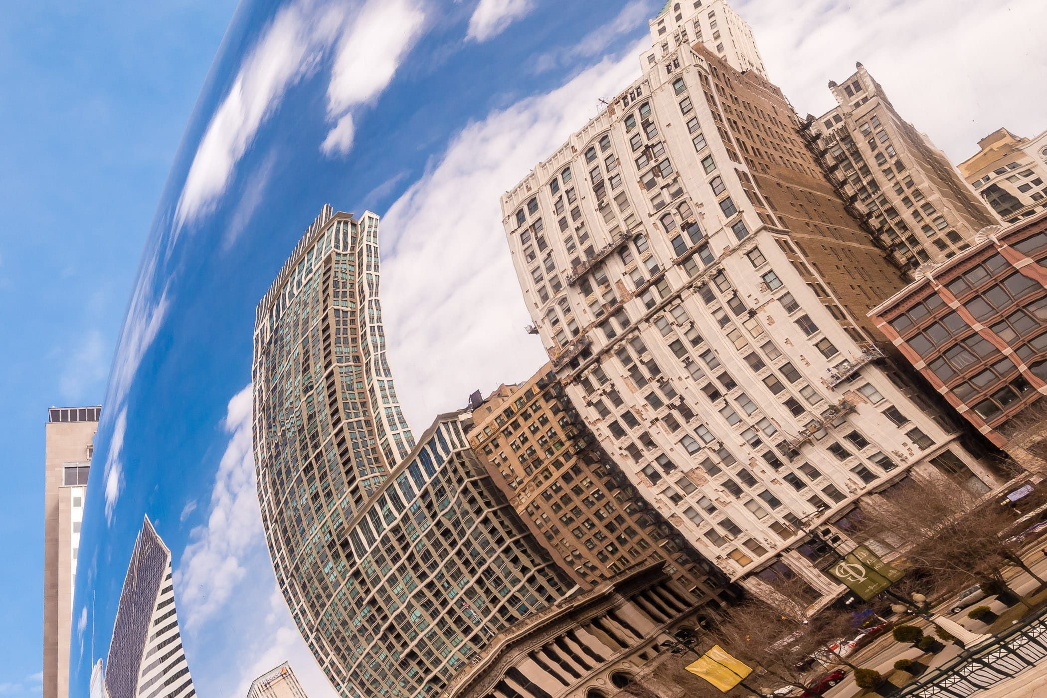 The reflections of adjacent buildings are bent and twisted in the polished stainless steel skin of Anish Kapoor’s Cloud Gate, colloquially known as “The Bean”, in Millennium Park, Chicago.