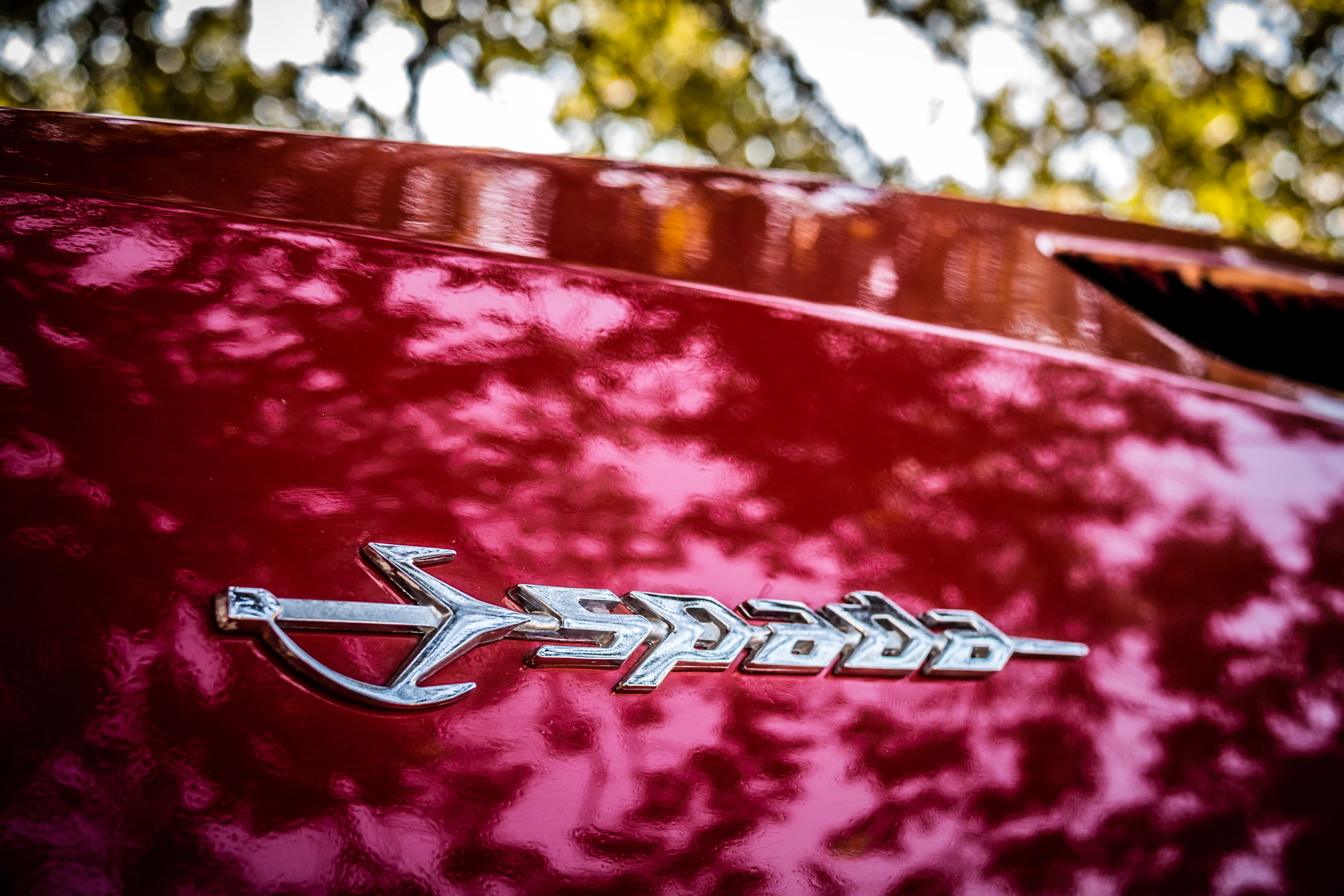 The stylized nameplate of a classic Lamborghini Espada, spotted at Grapevine, Texas' ItalianCarFest.