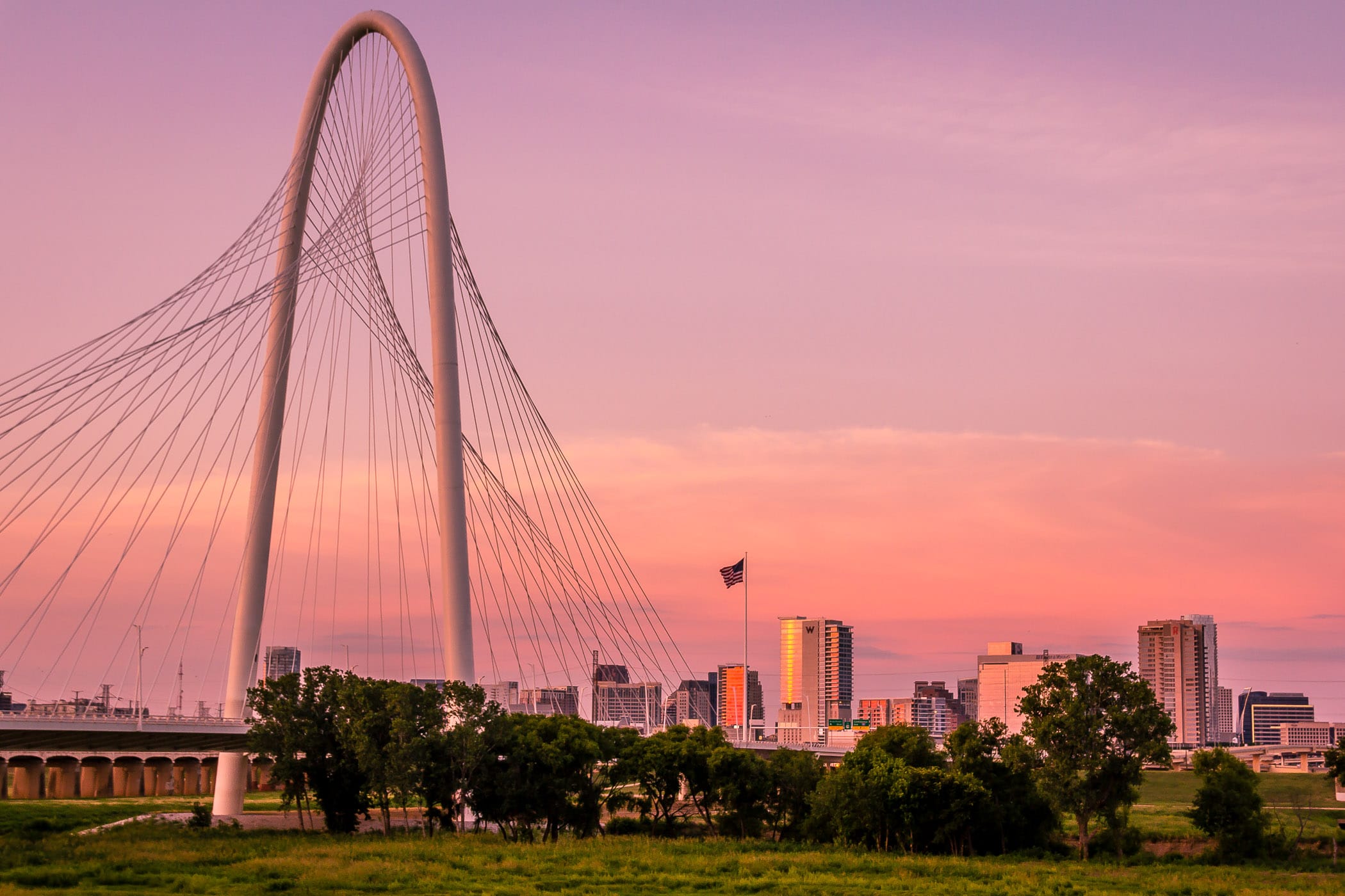 The sun sets on the Santiago Calatrava-designed Margaret Hunt Hill Bridge and Dallas' Uptown neighborhood.