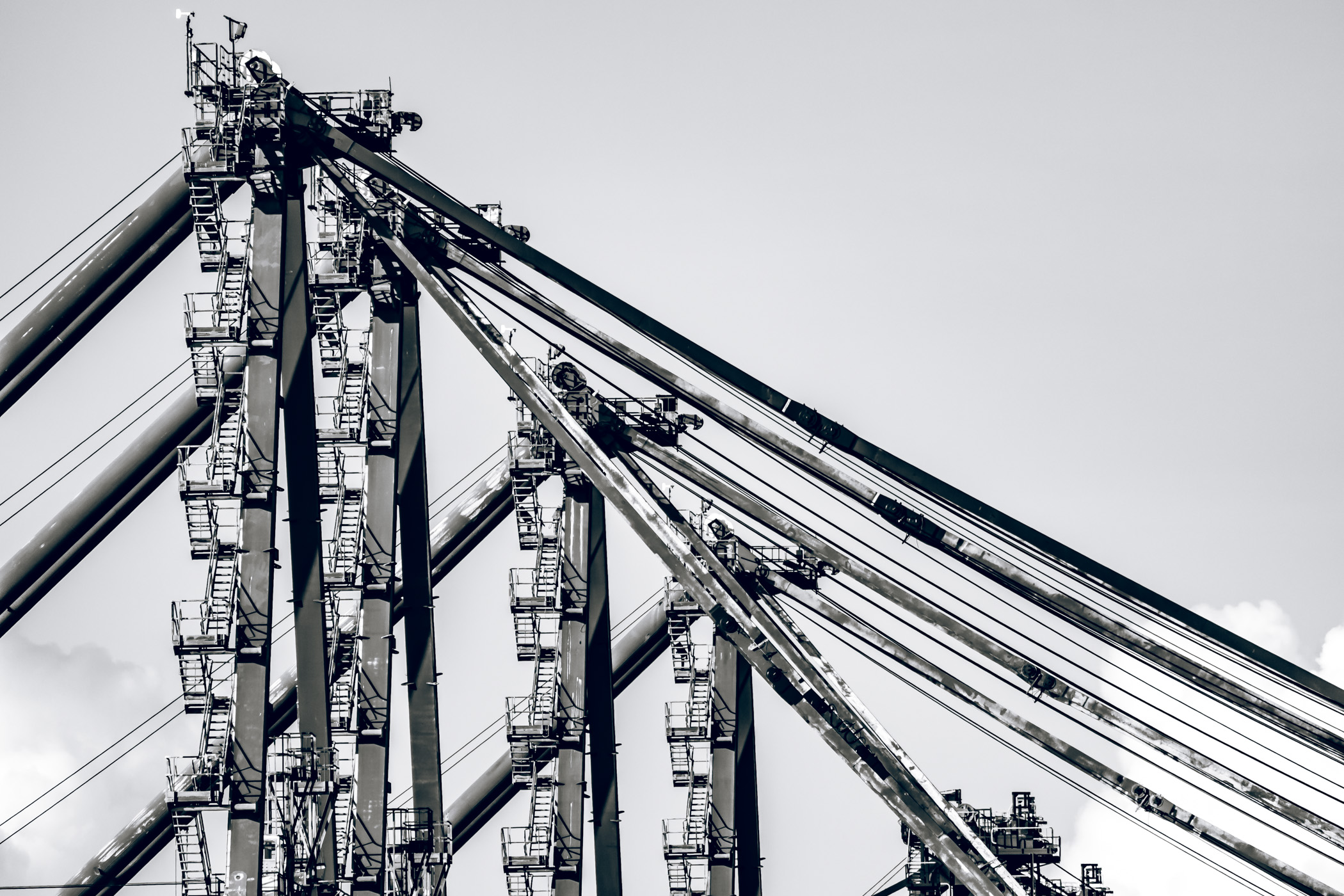 Detail of massive cranes for loading and unloading cargo containers aboard ships at Freeport, Bahamas.