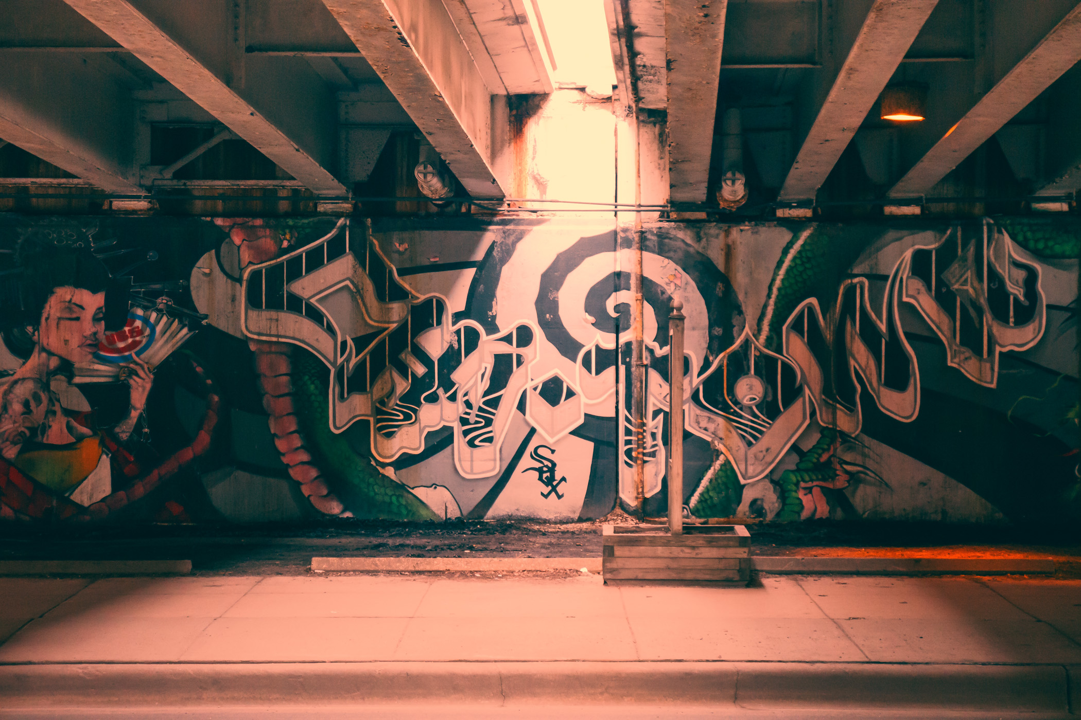 A sliver of sunlight illuminates graffiti on the lower level of Chicago's Lake Shore Drive.