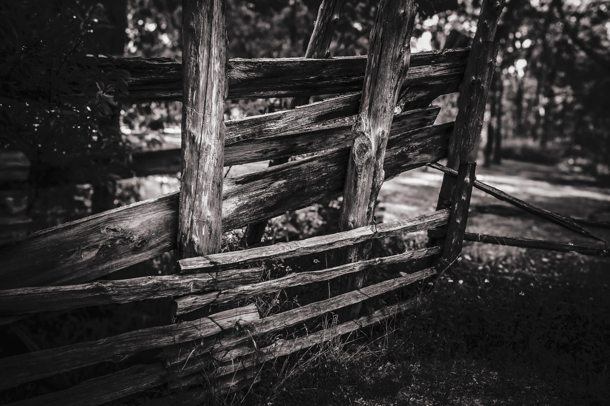 A dilapidated wooden fence at Texas' Cedar Hill State Park's Penn Farm.