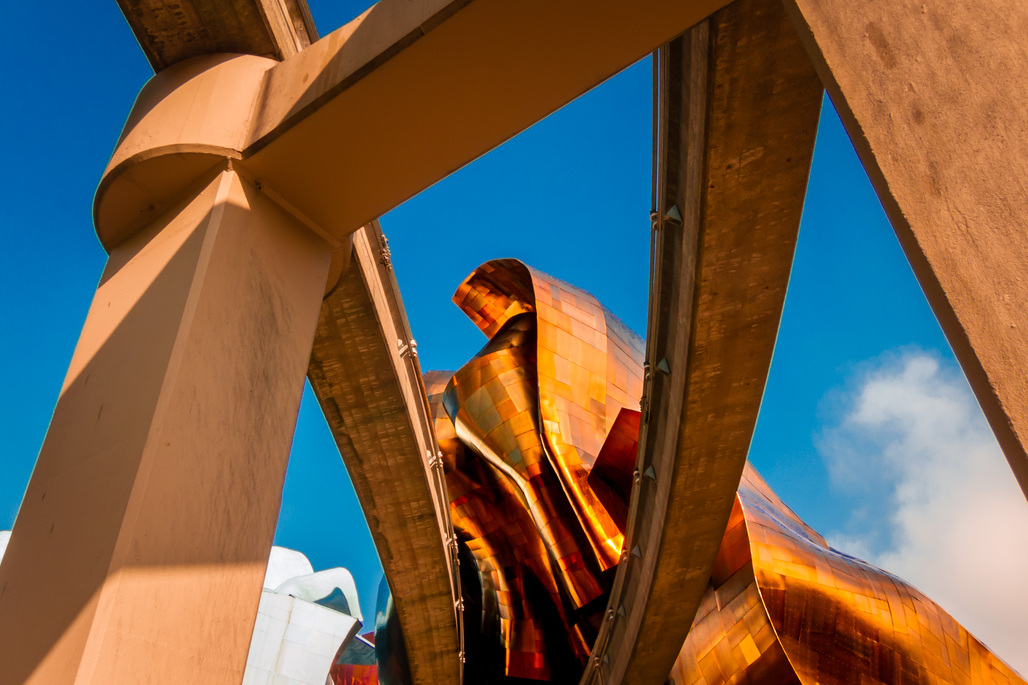 The morning sun illuminates tracks of the Seattle Monorail leading to the Frank Gehry-designed EMP Museum.