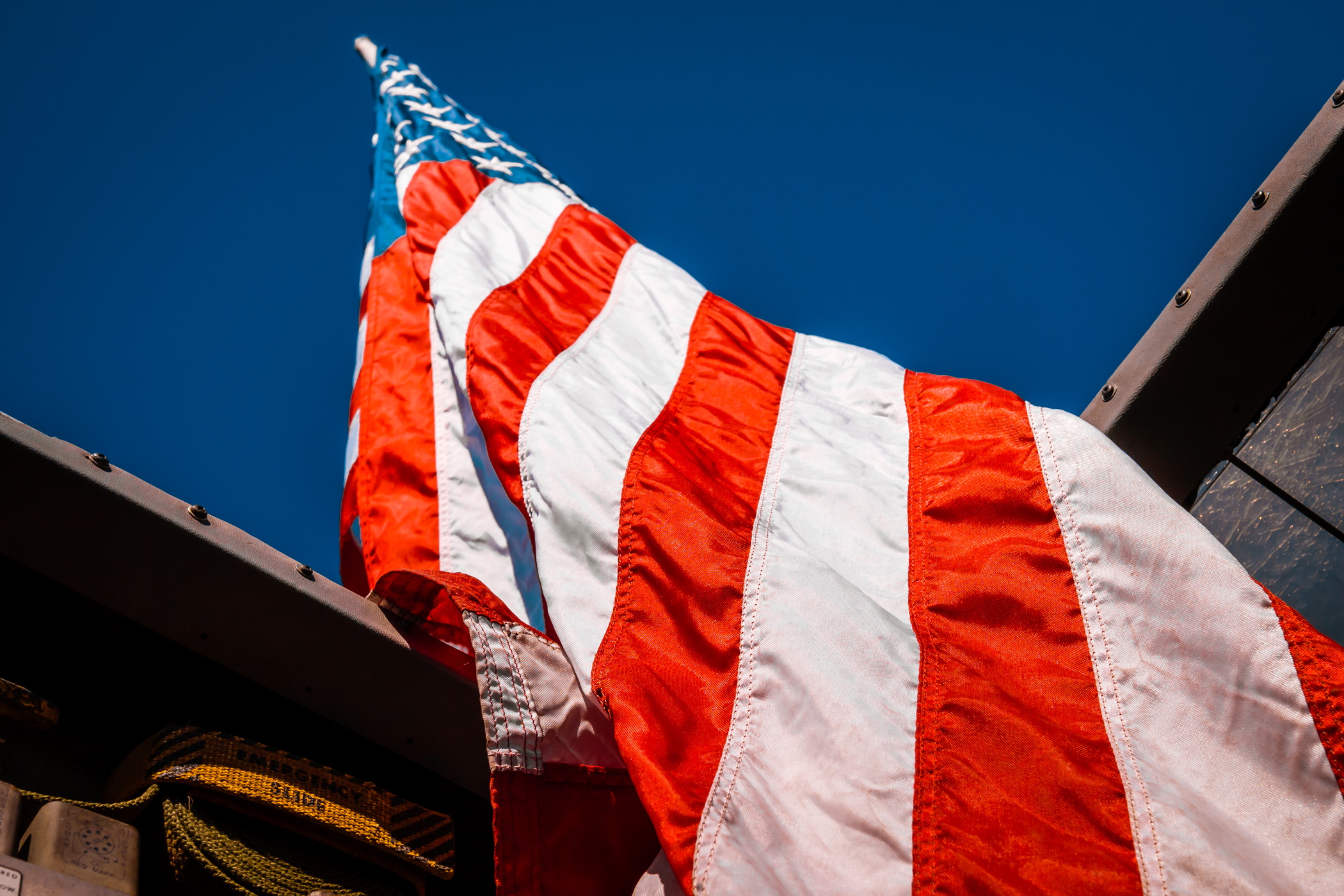 An American flag flies on an U.S. Army de Havilland Canada DHC-4 Caribou at the Cavanaugh Flight Museum, Addison, Texas.