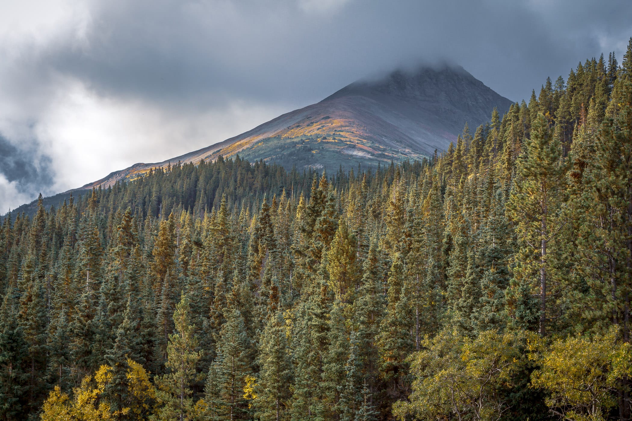 Low clouds roll over a mountain near the shore of Tutshi Lake in British Columbia's Stikine Region.