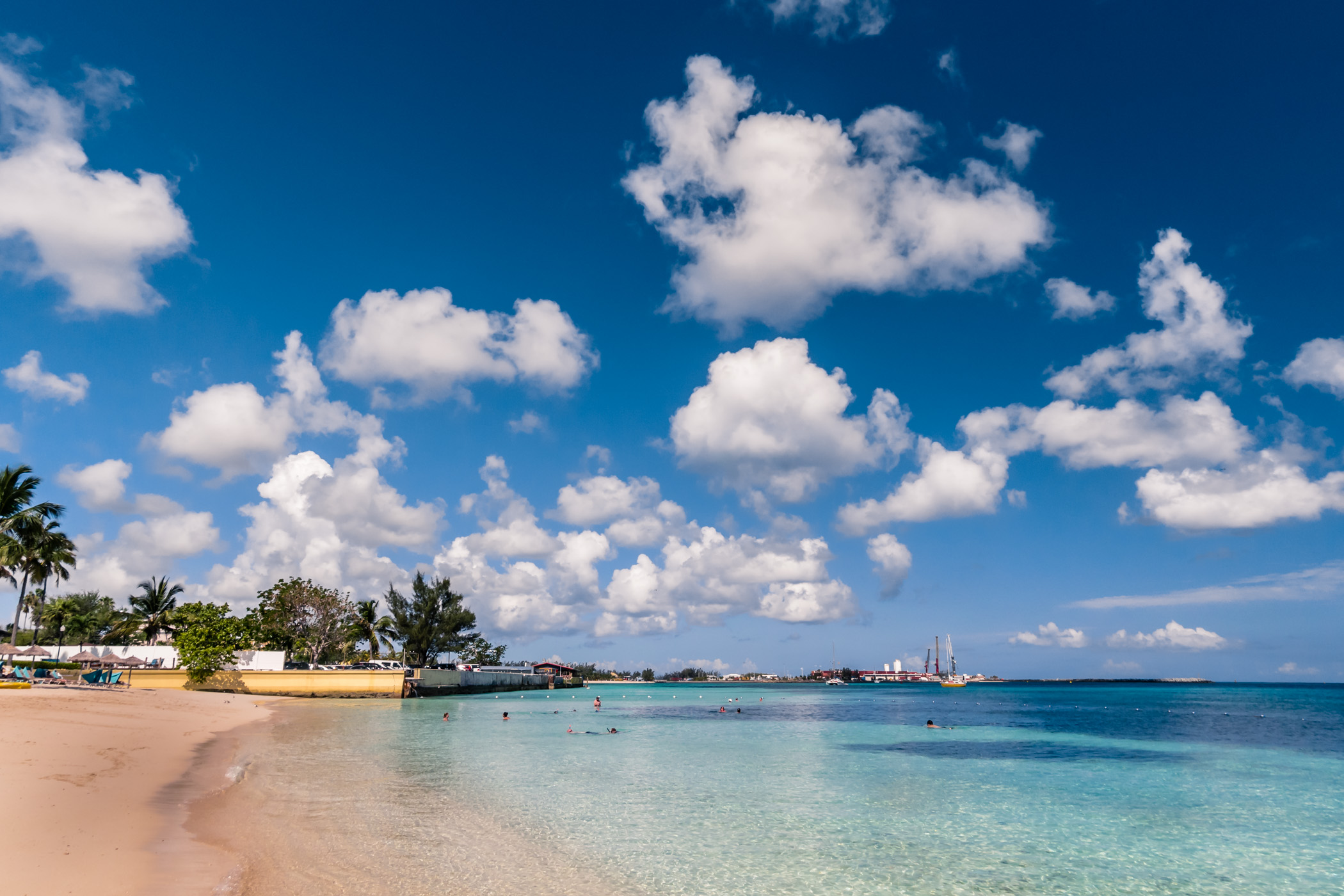 Clouds float over the harbor at Nassau, Bahamas, as seen from a beach at the British Colonial Hilton.