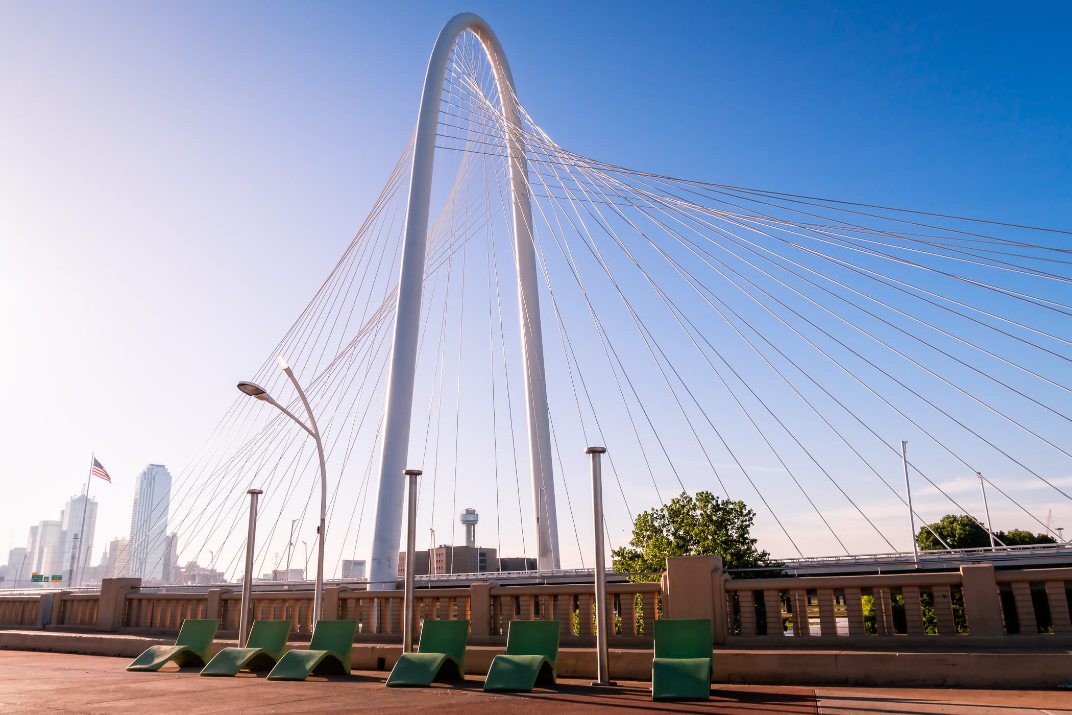 Lounge chairs sit along the Ronald Kirk Bridge park (formerly the Continental Avenue Bridge) in the shadow of Dallas' Margaret Hunt Hill Bridge.