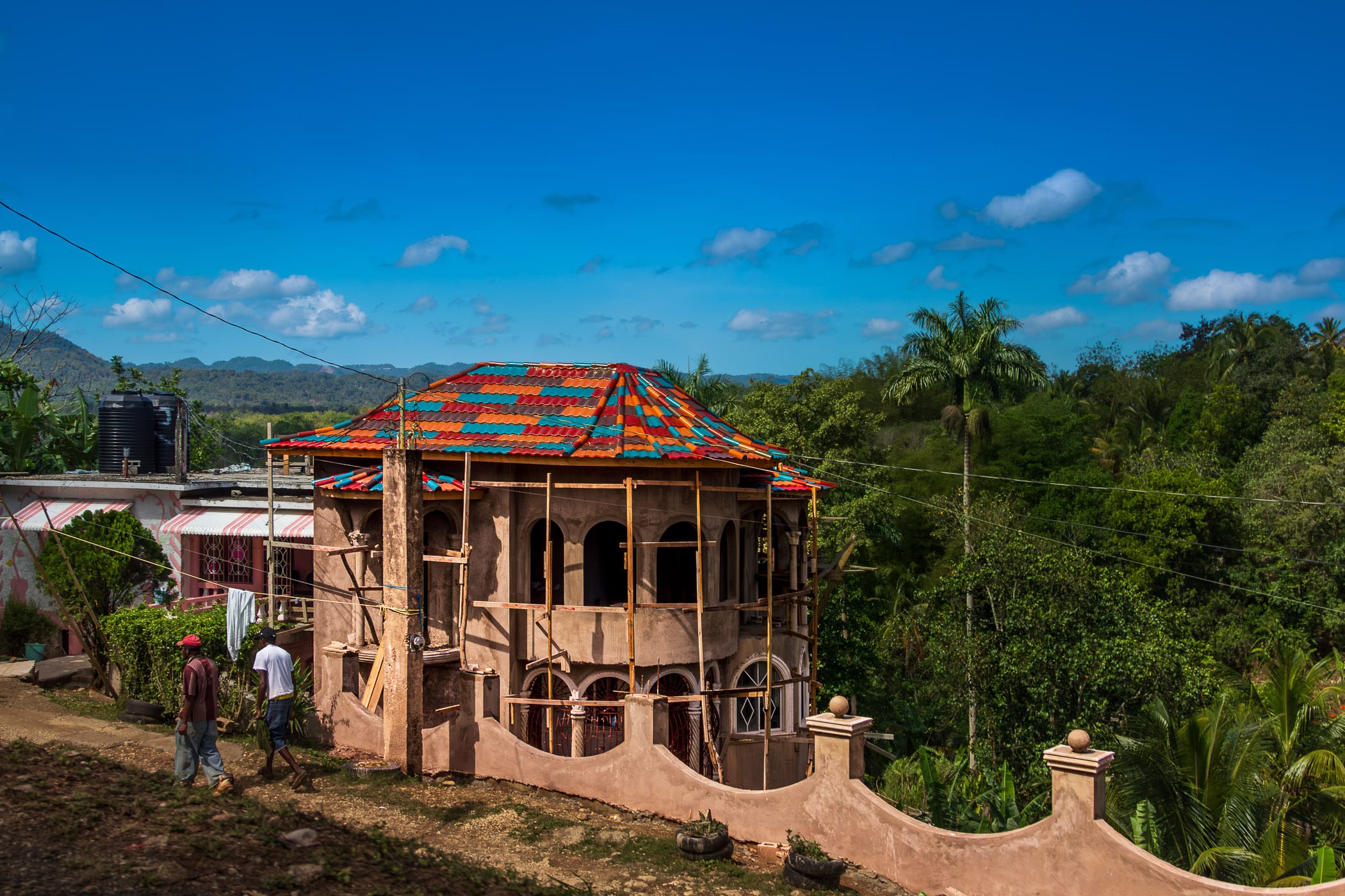 A house under construction amongst the forest and hills of Cambridge, Jamaica.