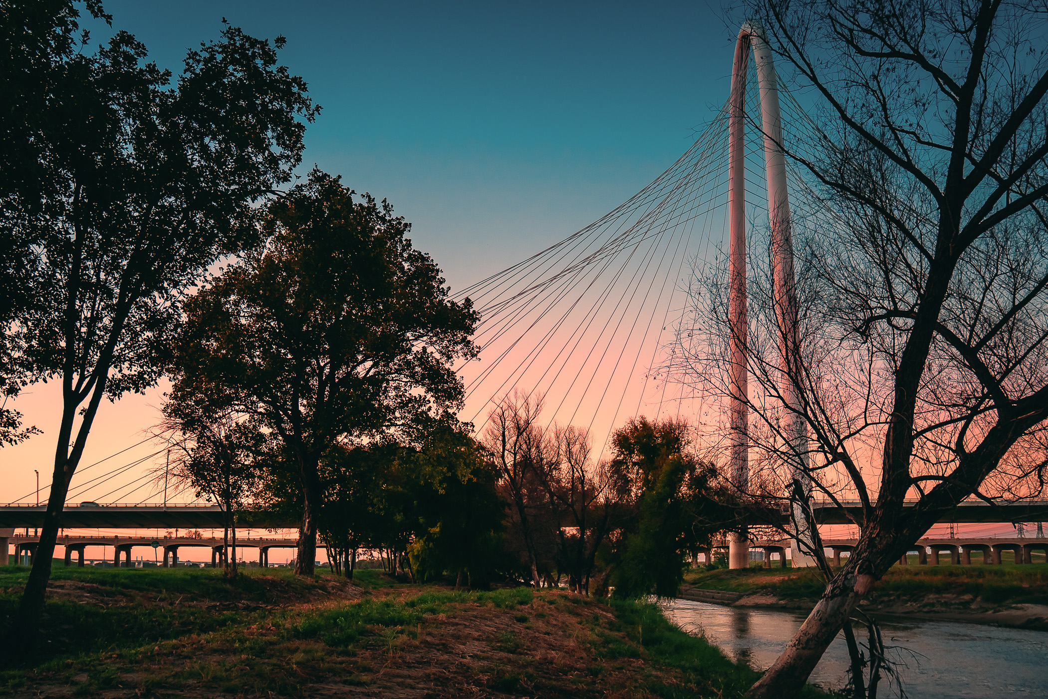 The sun sets on Dallas' Santiago Calatrava-designed Margaret Hunt Hill Bridge.