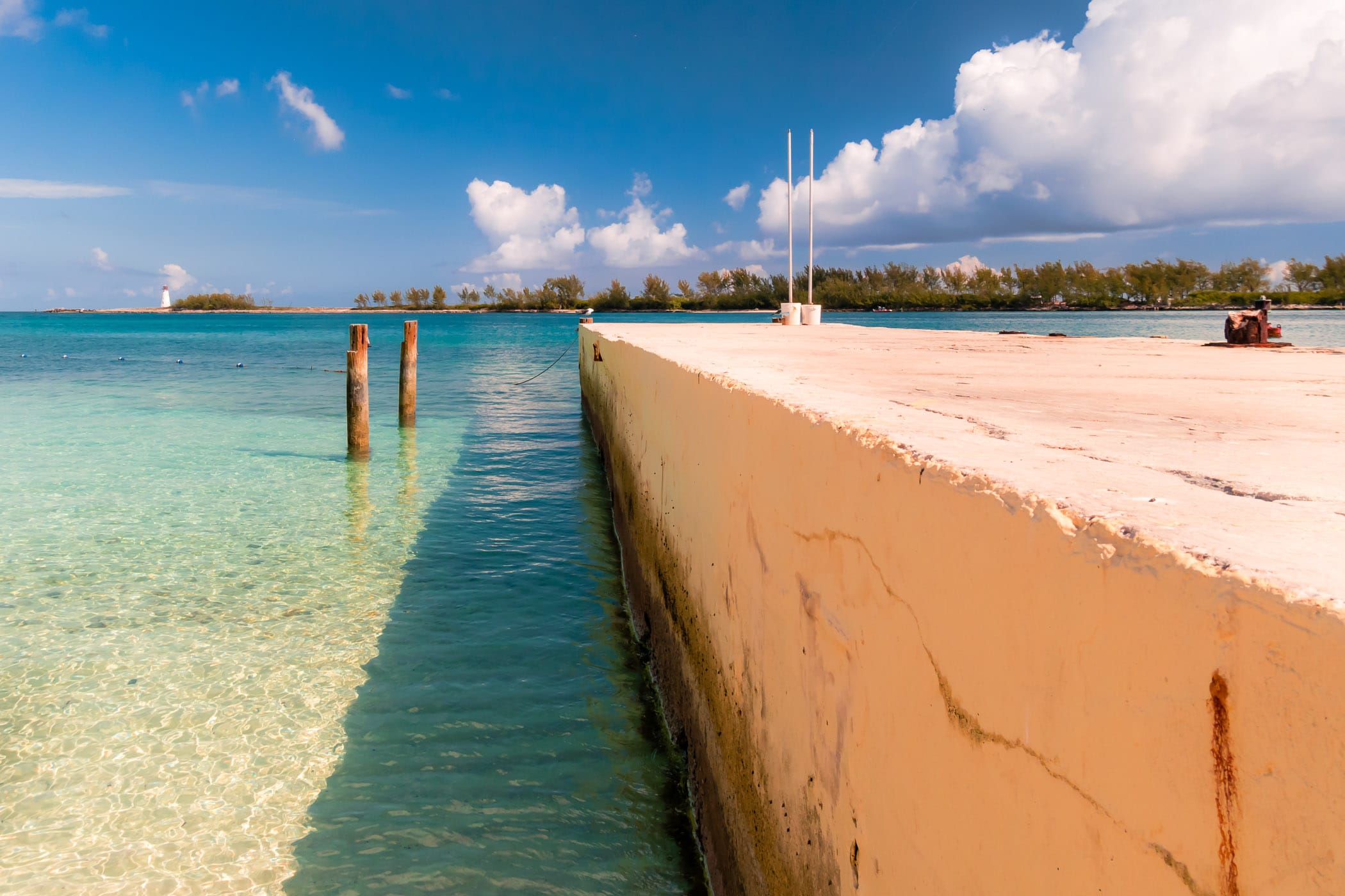 A barrier extends from the beach into the harbour at Nassau, Bahamas.