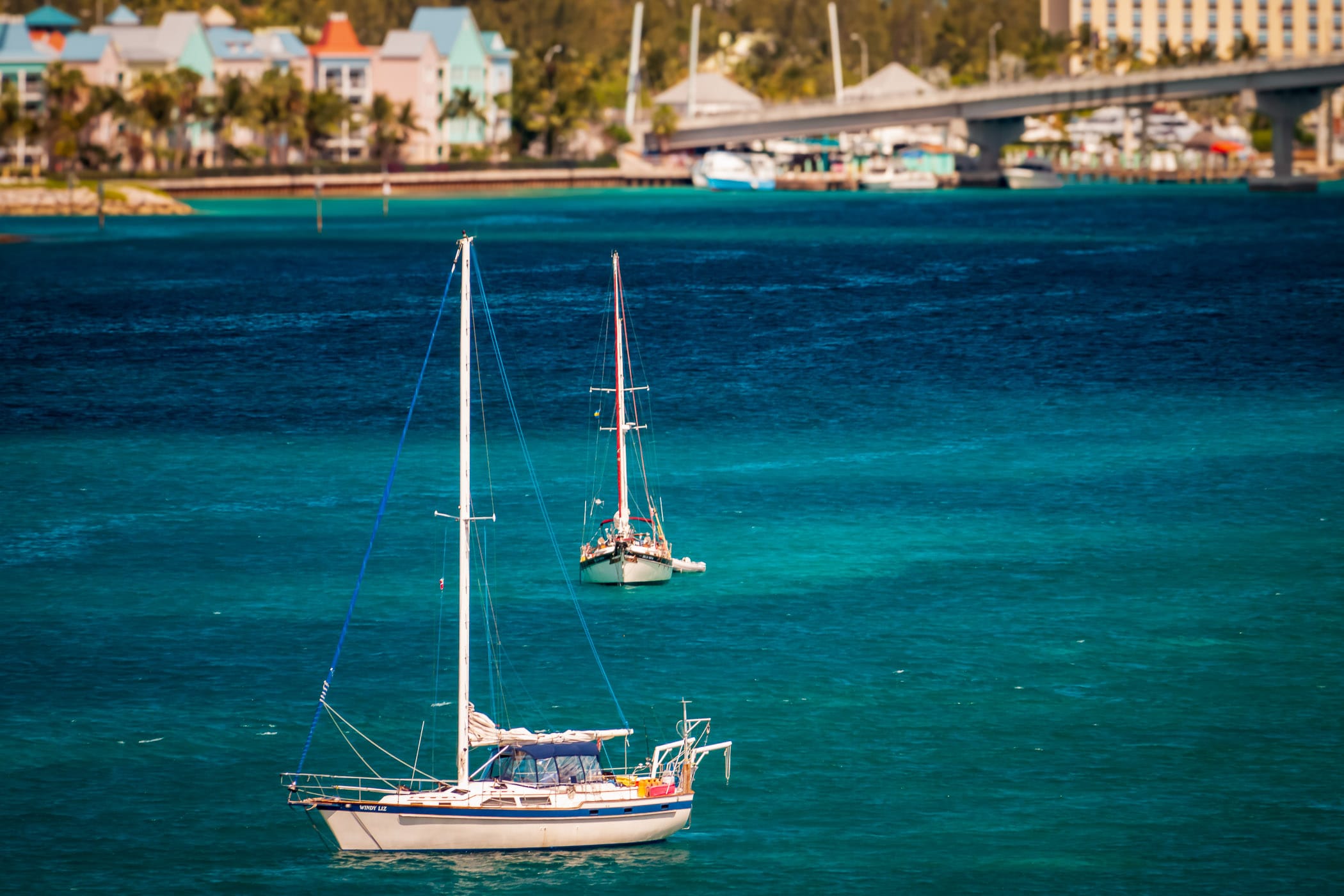 Two sailboats float in the harbour at Nassau, Bahamas.