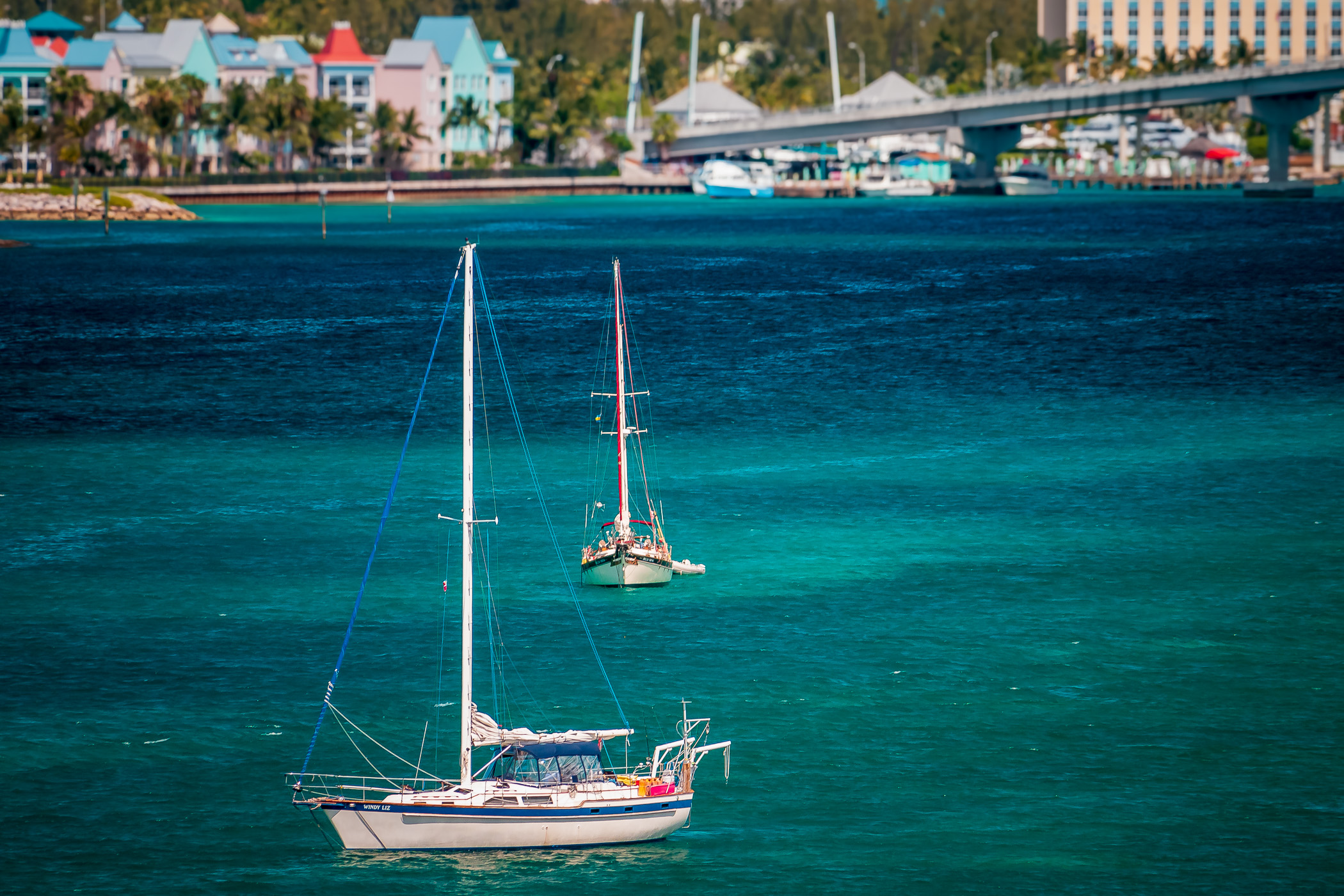 Two sailboats float in the harbour at Nassau, Bahamas.