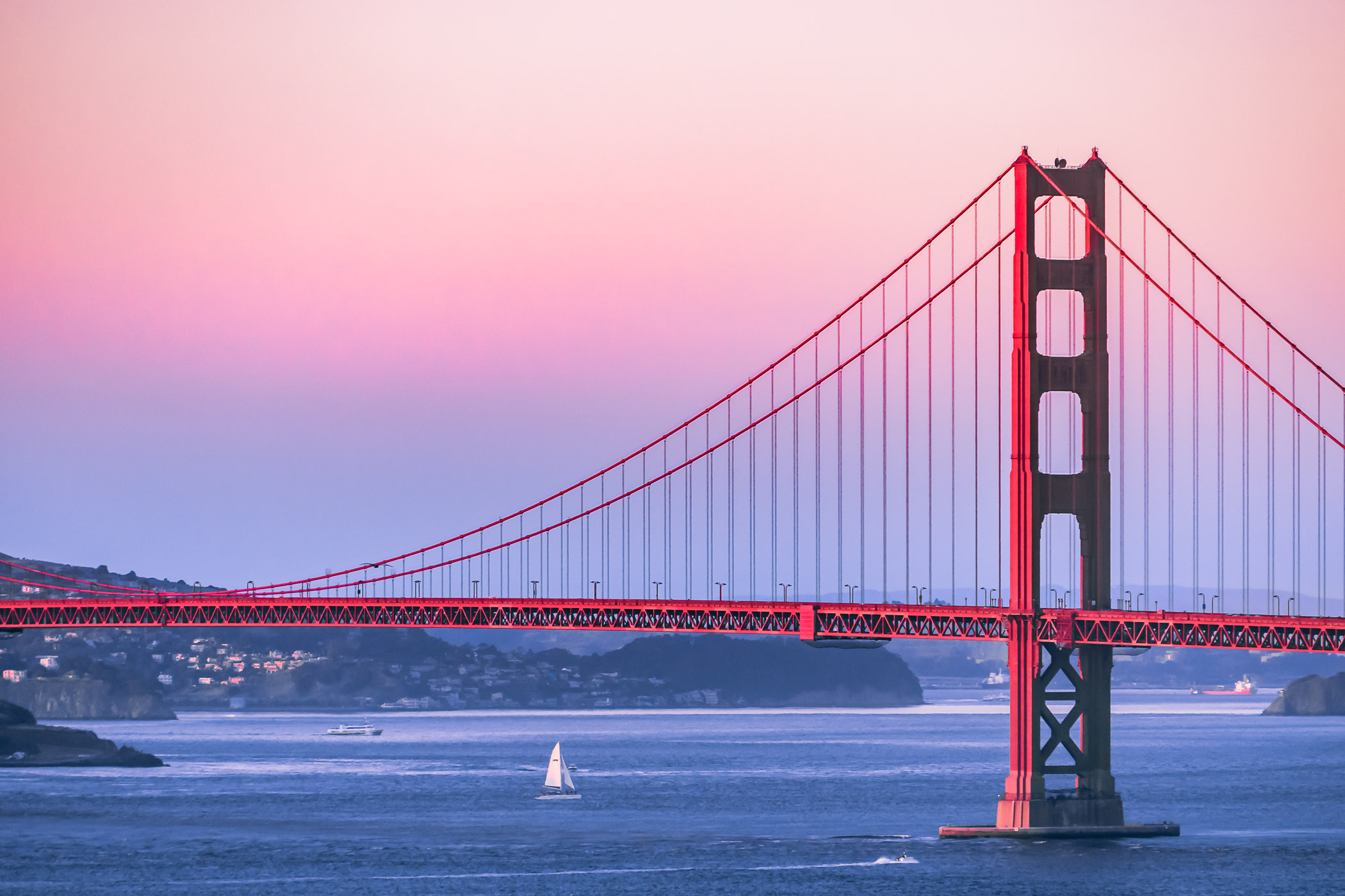 The last light of the day illuminates San Francisco's Golden Gate Bridge.