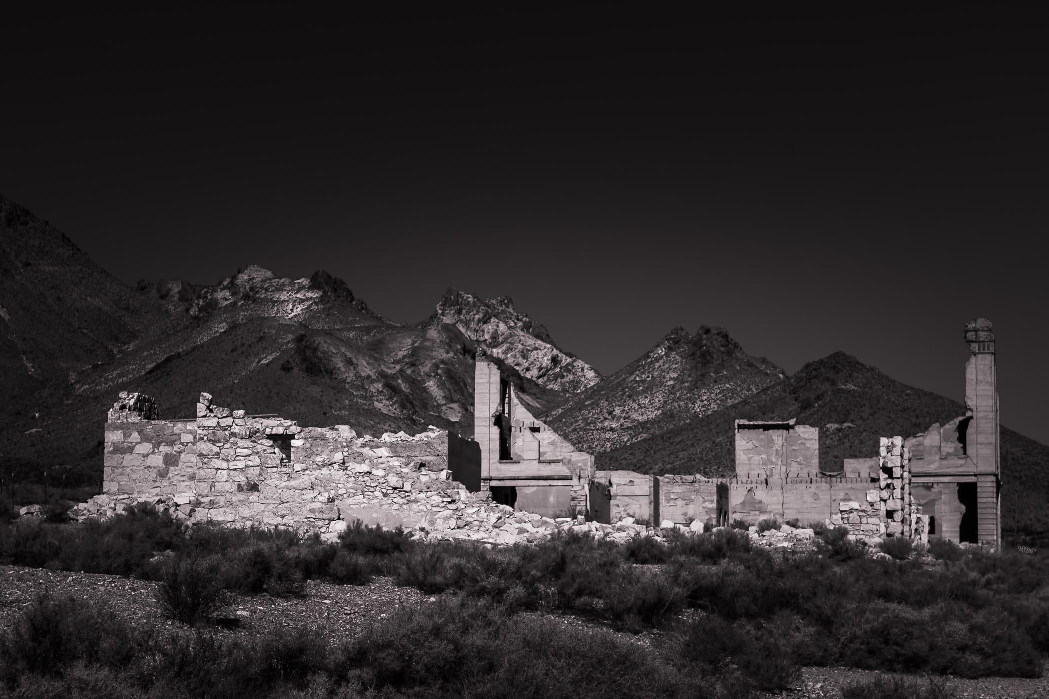 Ruins at the ghost town of Rhyolite, Nevada, sprawl in the desert near the California border.