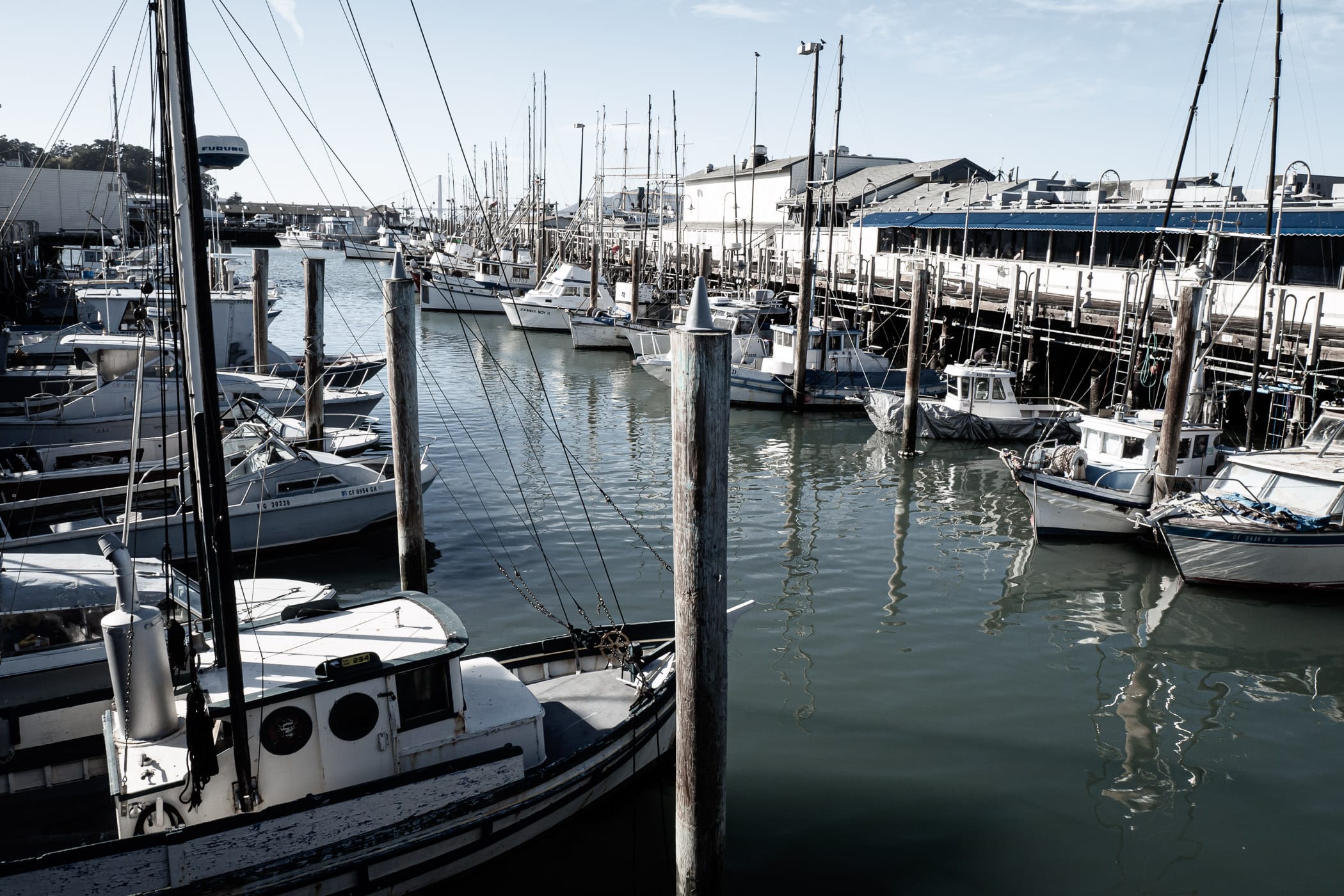 Boats docked at a pier along San Francisco’s Fisherman’s Wharf.