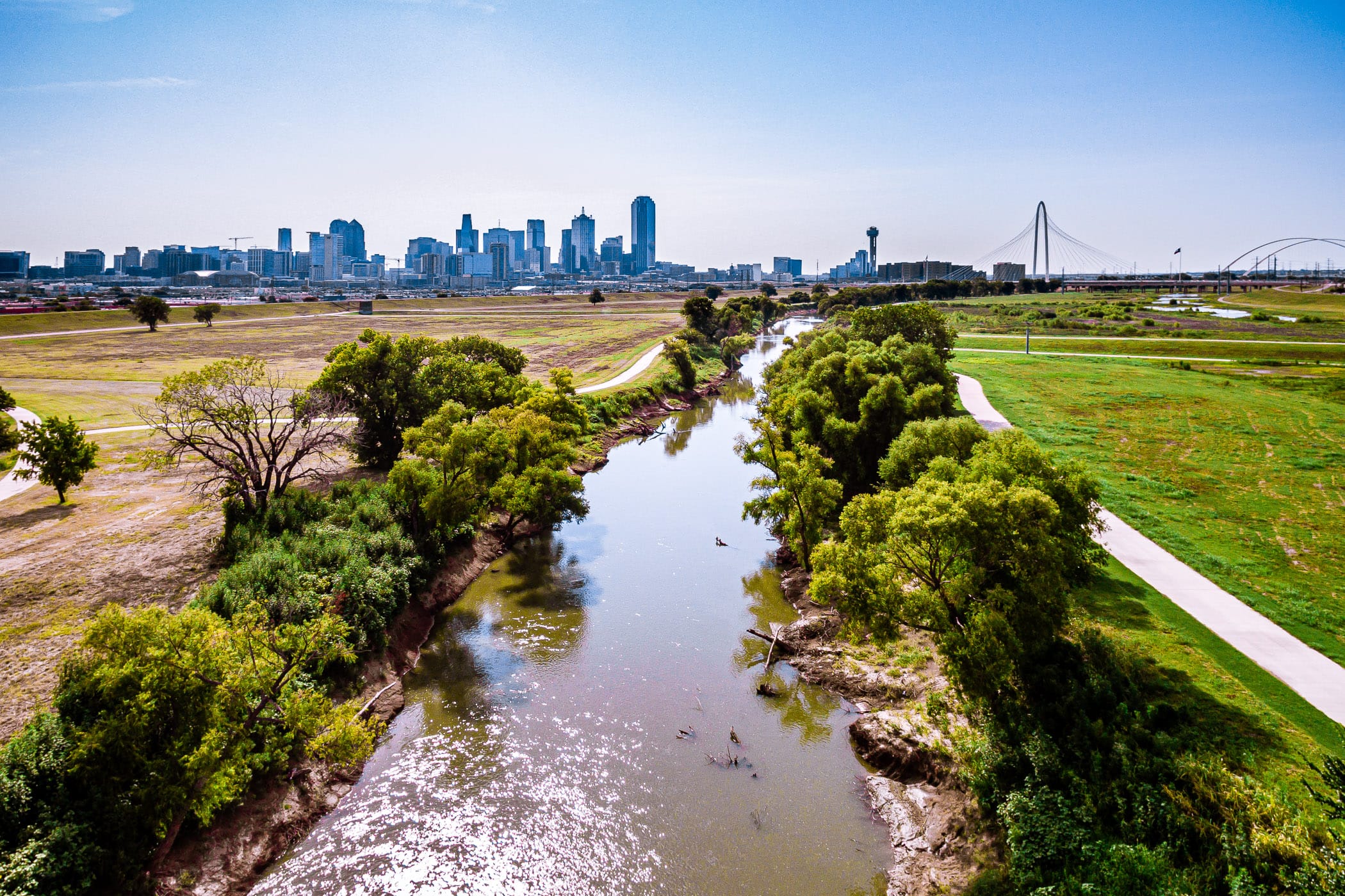 The Trinity River flows towards Downtown Dallas.