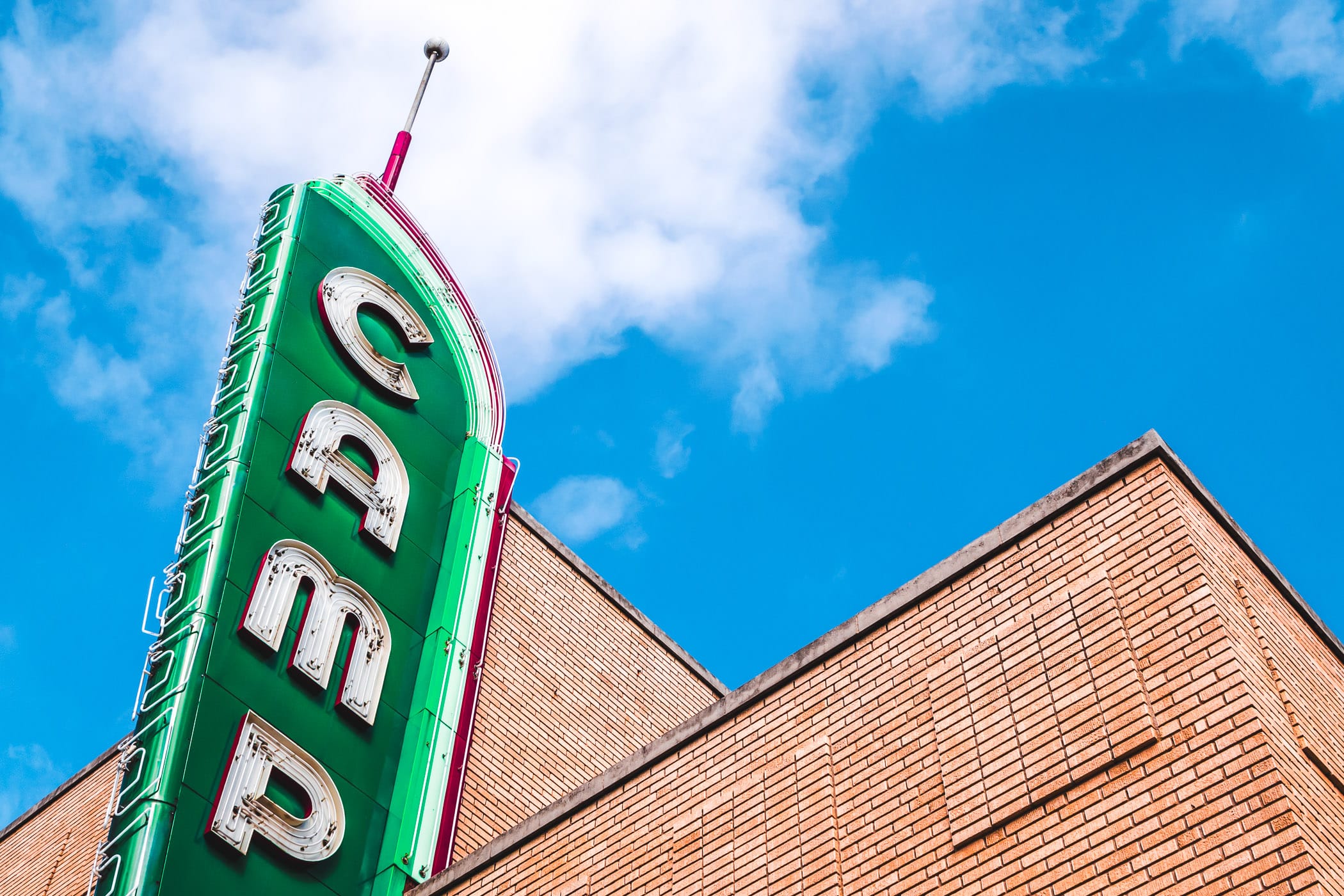 Denton, Texas' Campus Theatre's sign rises into the North Texas sky.