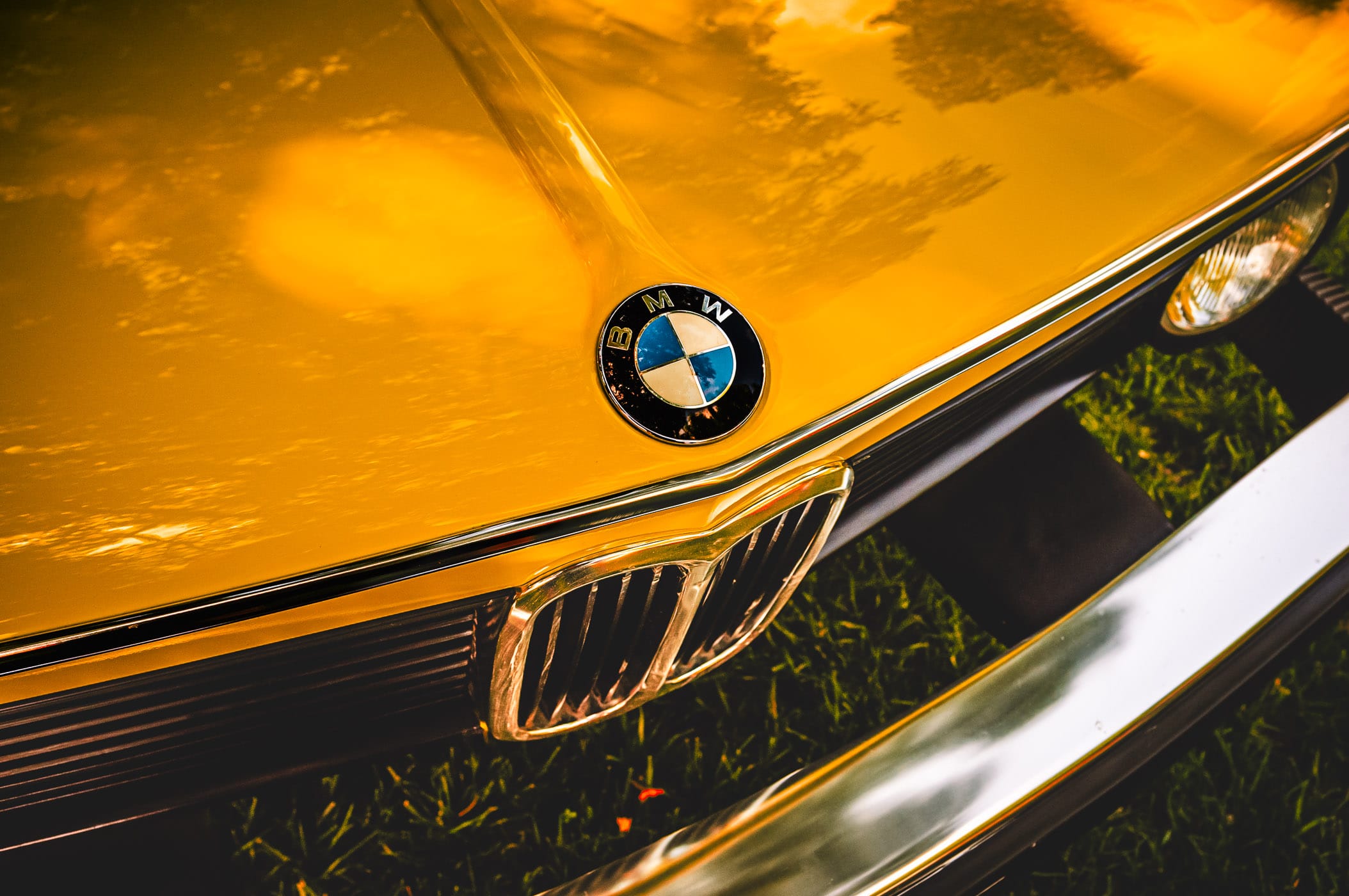 The badge of a classic BMW 2002 at the Autos in the Park event at Dallas’ Cooper Aerobics Center.