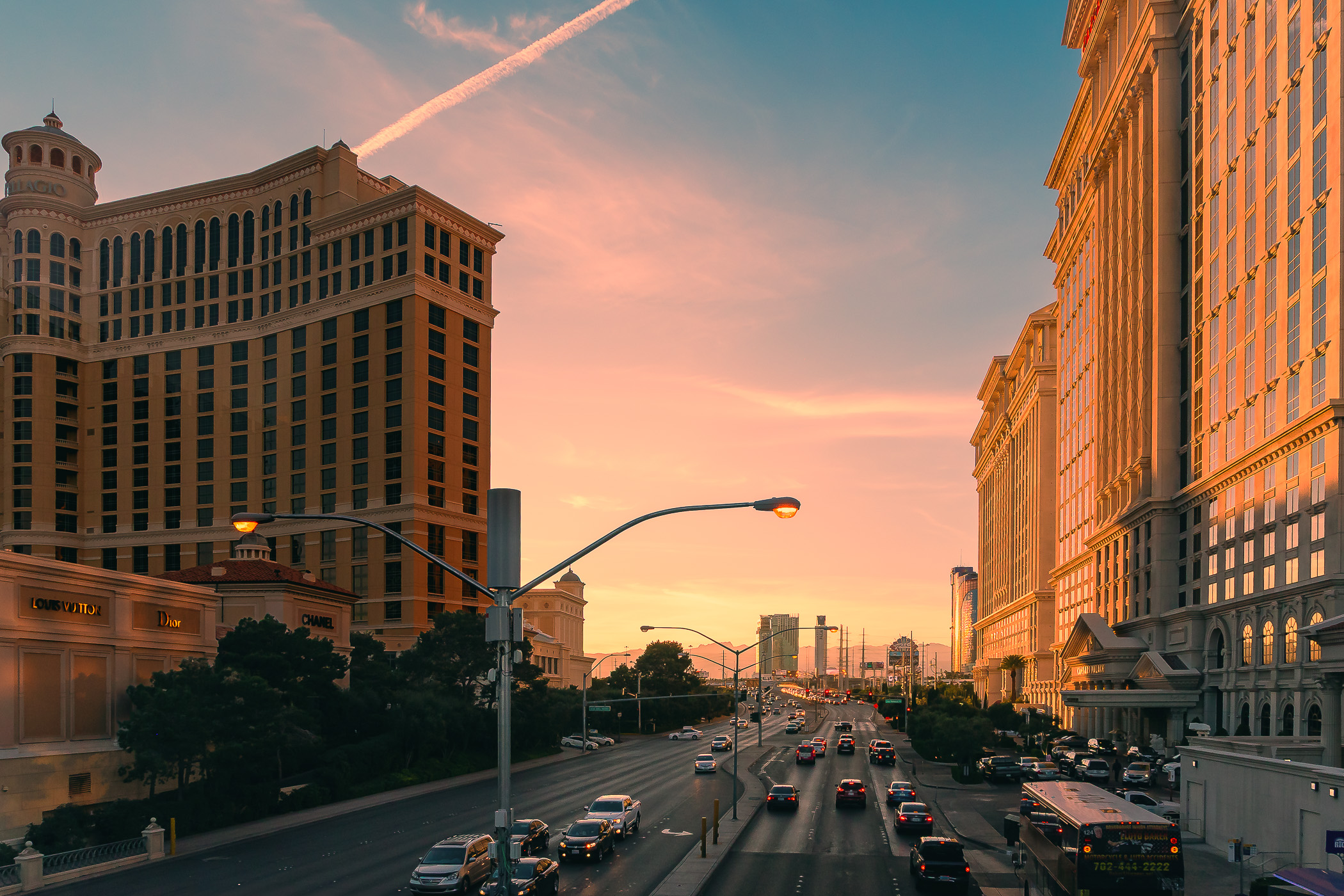 The setting sun illuminates a view past the Bellagio and Caesars Palace towards The Palms down Las Vegas' Flamingo Road.