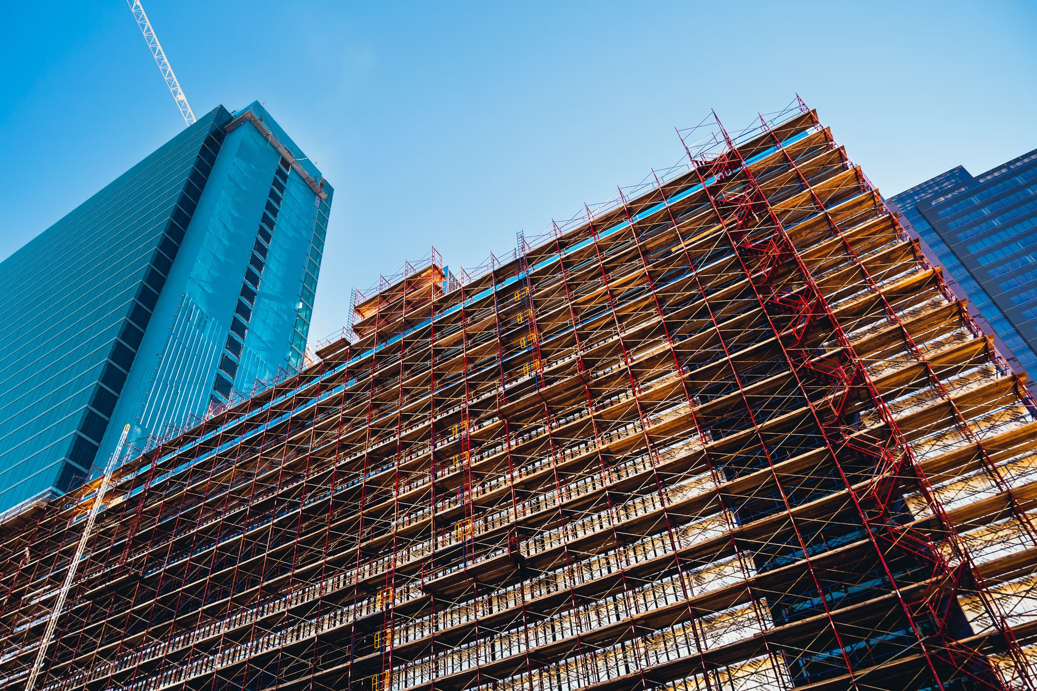 A massive scaffold surrounds a construction site in Downtown Houston, Texas.