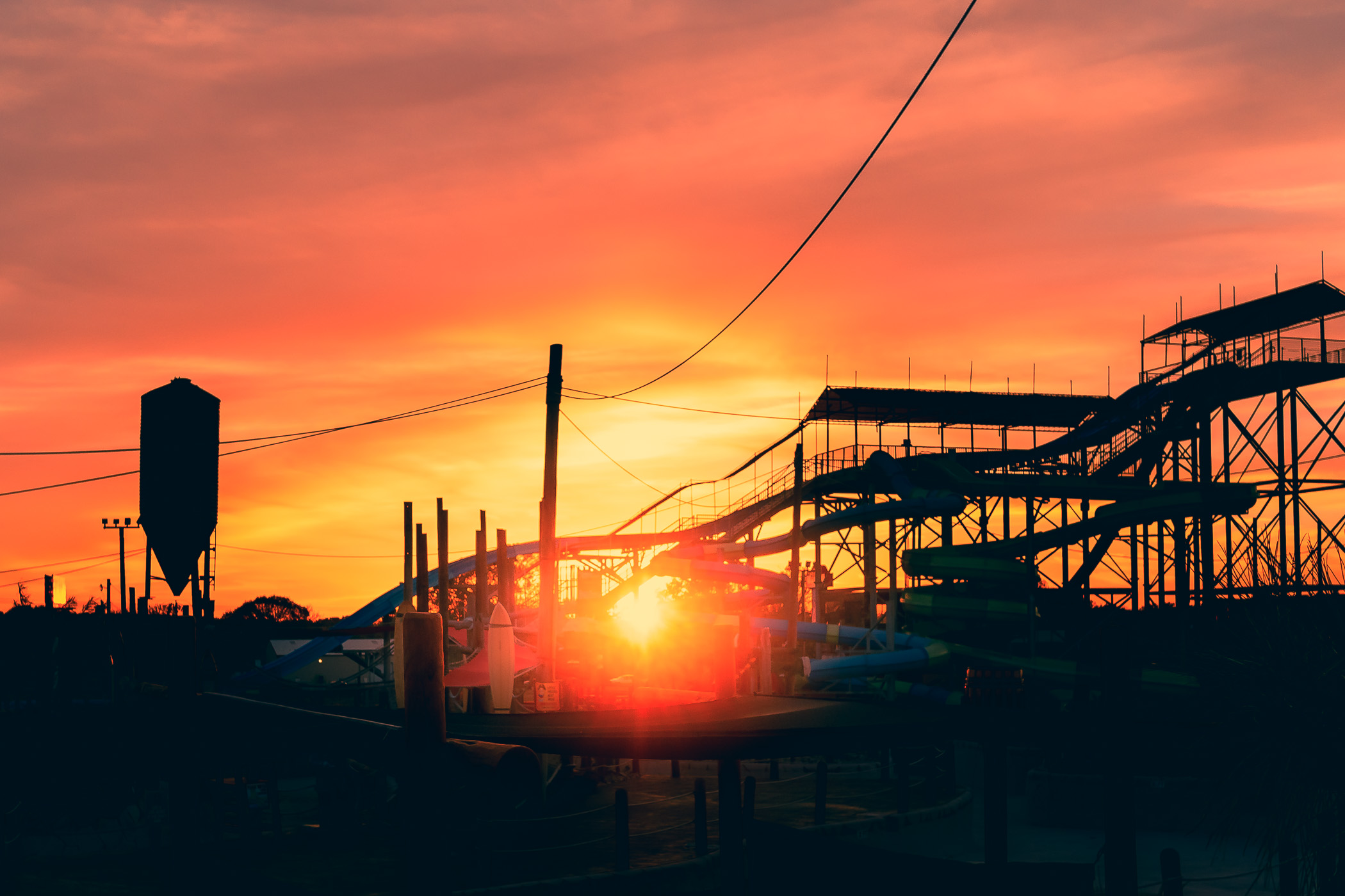 The sun sets on water slides at Pirates' Cove water park in Burleson, Texas.