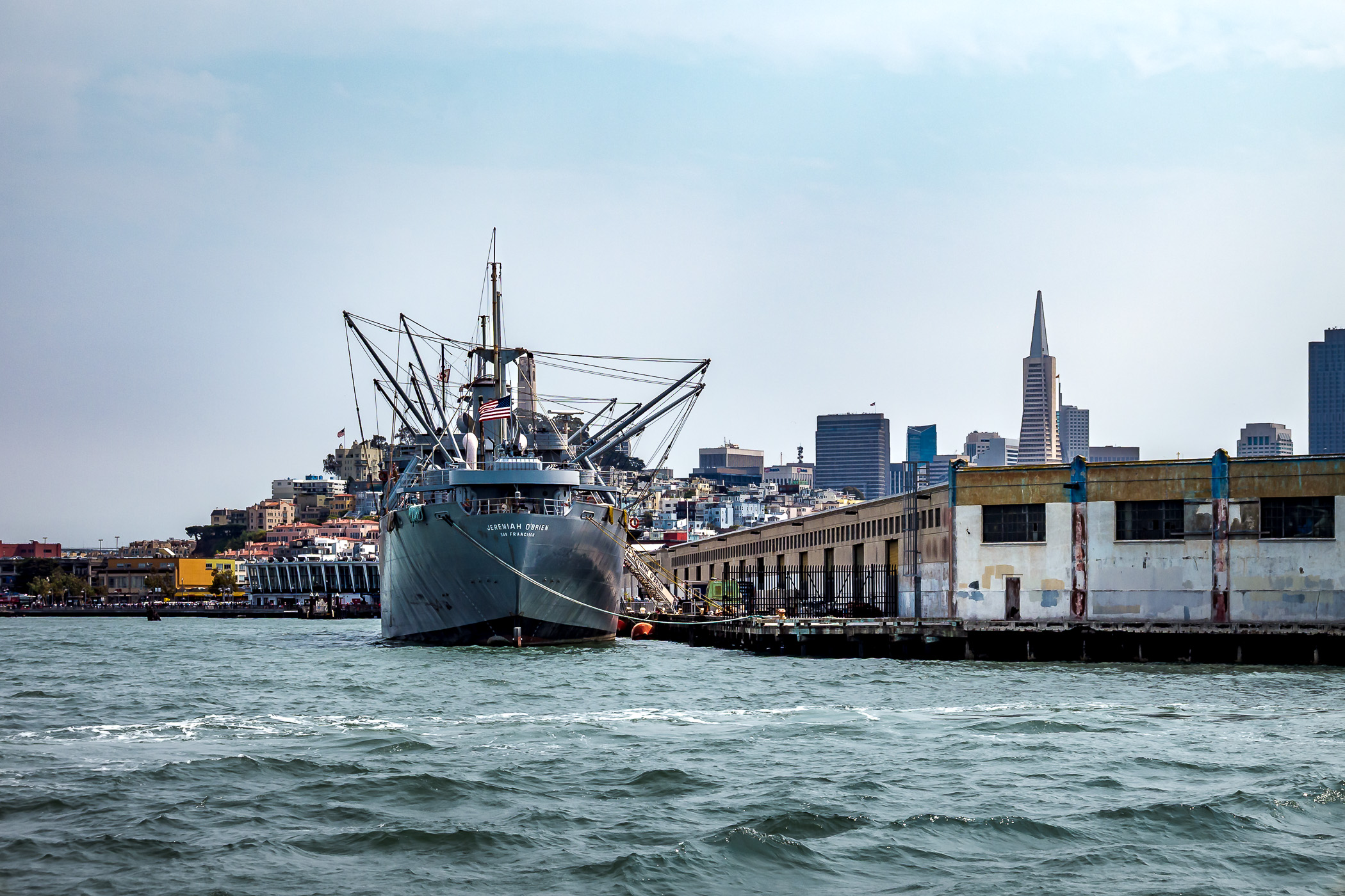 The SS Jeremiah O’Brien—one of only two surviving operational Liberty ships from World War II—docked at San Francisco’s Pier 45 with the city as its backdrop.