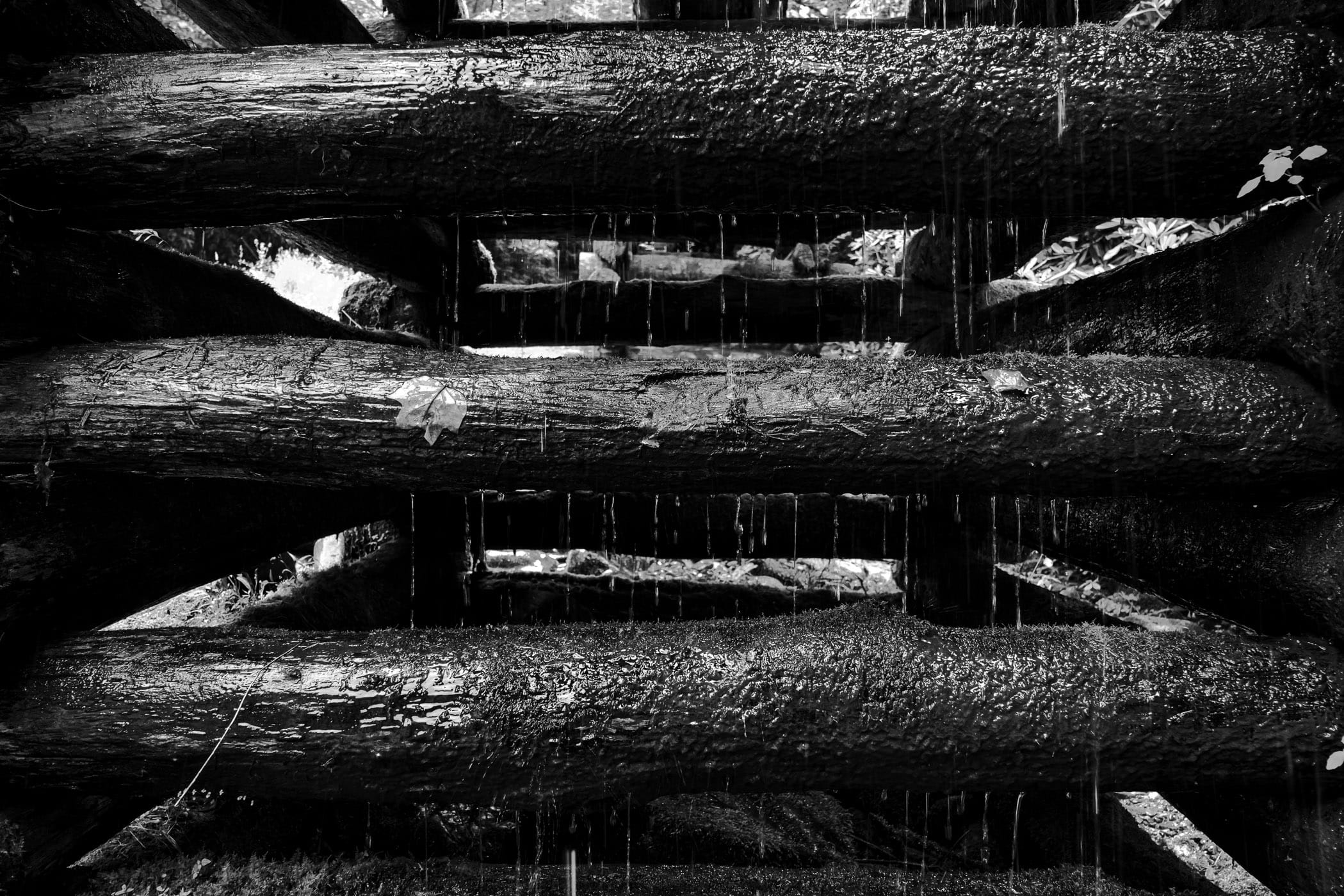 Water drips down the support structure of a flume at the historic Mingus Grist Mill in the Great Smoky Mountains National Park, Tennessee.