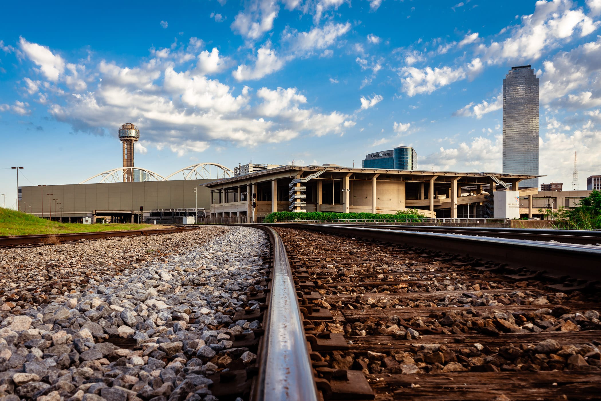 A railroad line leads towards the Dallas Convention Center and its adjacent heliport.