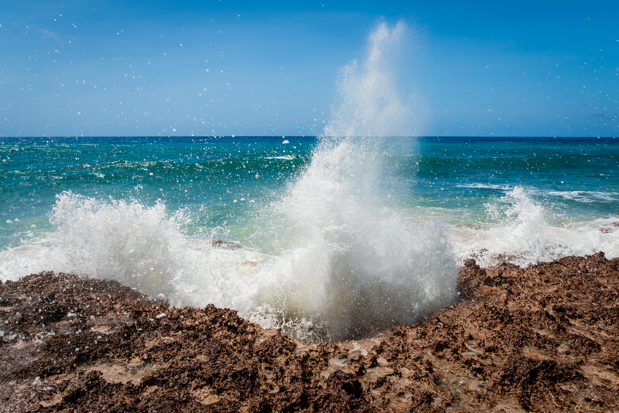 Waves crash onshore at El Mirador, Cozumel, Mexico.