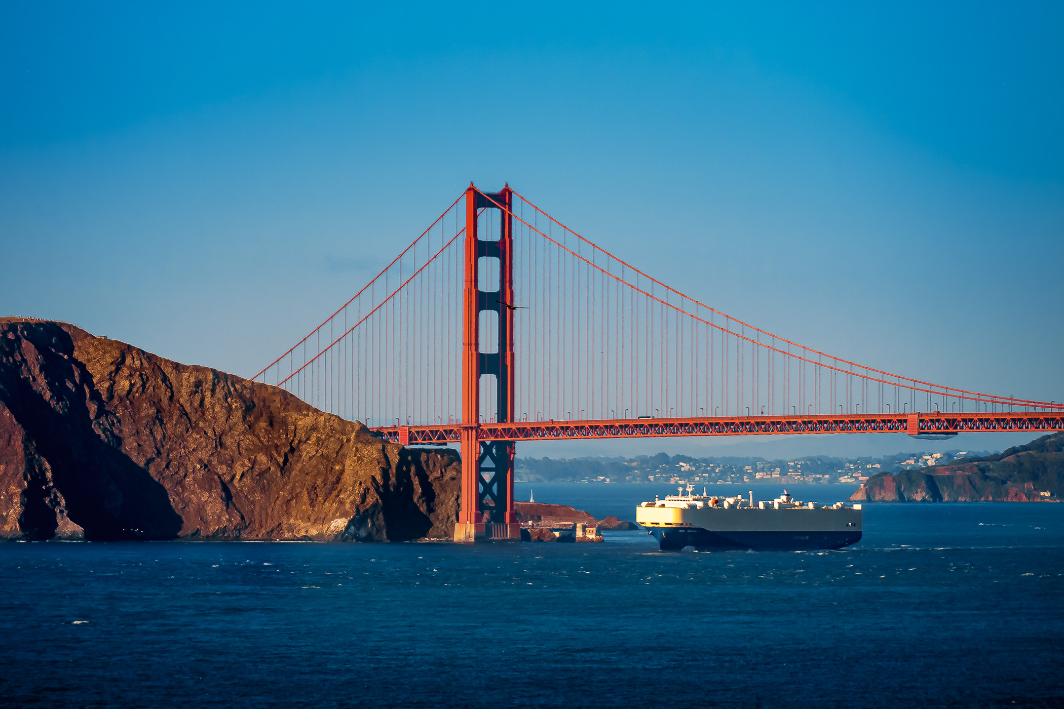 A roll-on/roll-off ship sails underneath the Golden Gate Bridge as it enters San Francisco Bay.