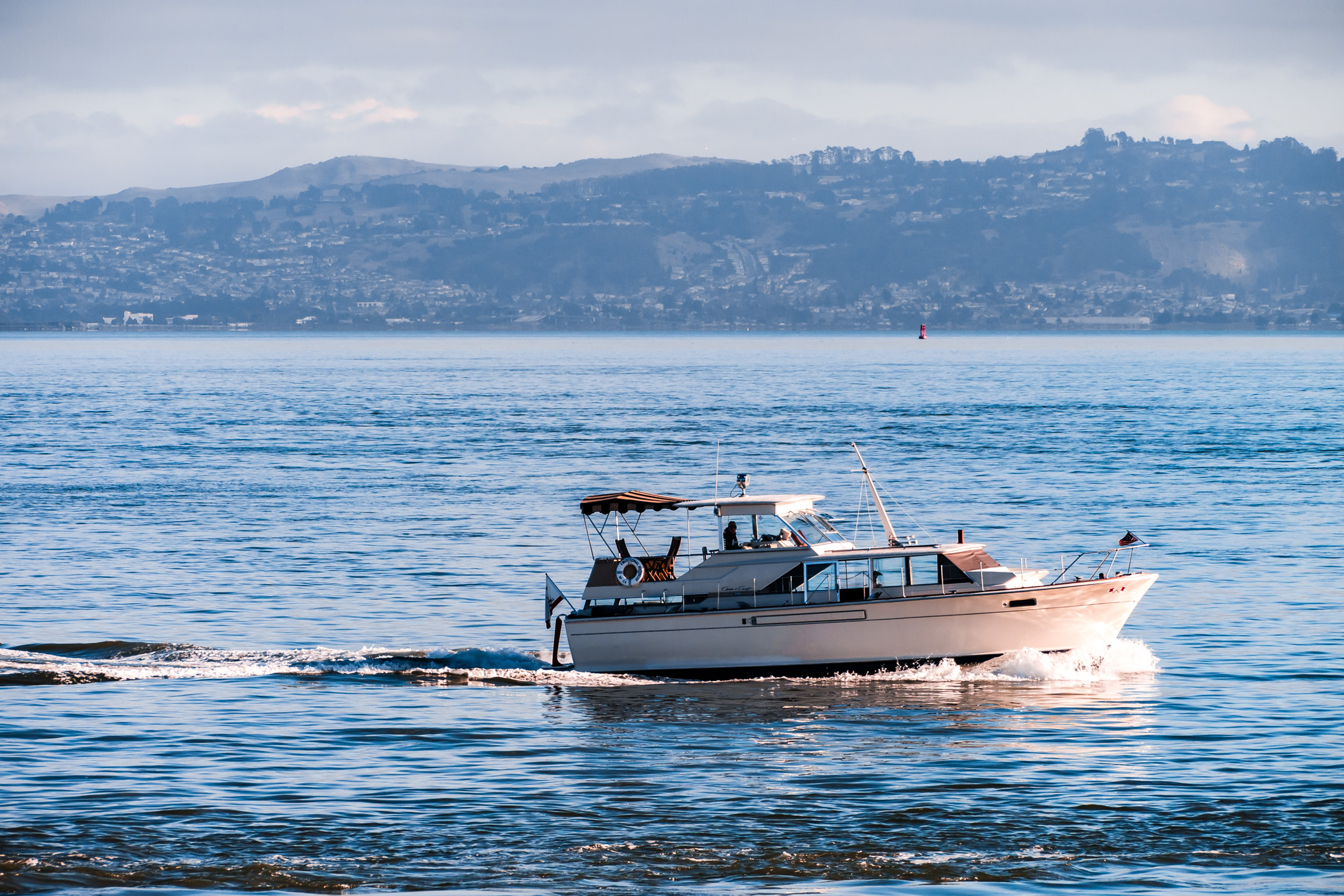 A boat cruises the waters of San Francisco Bay.