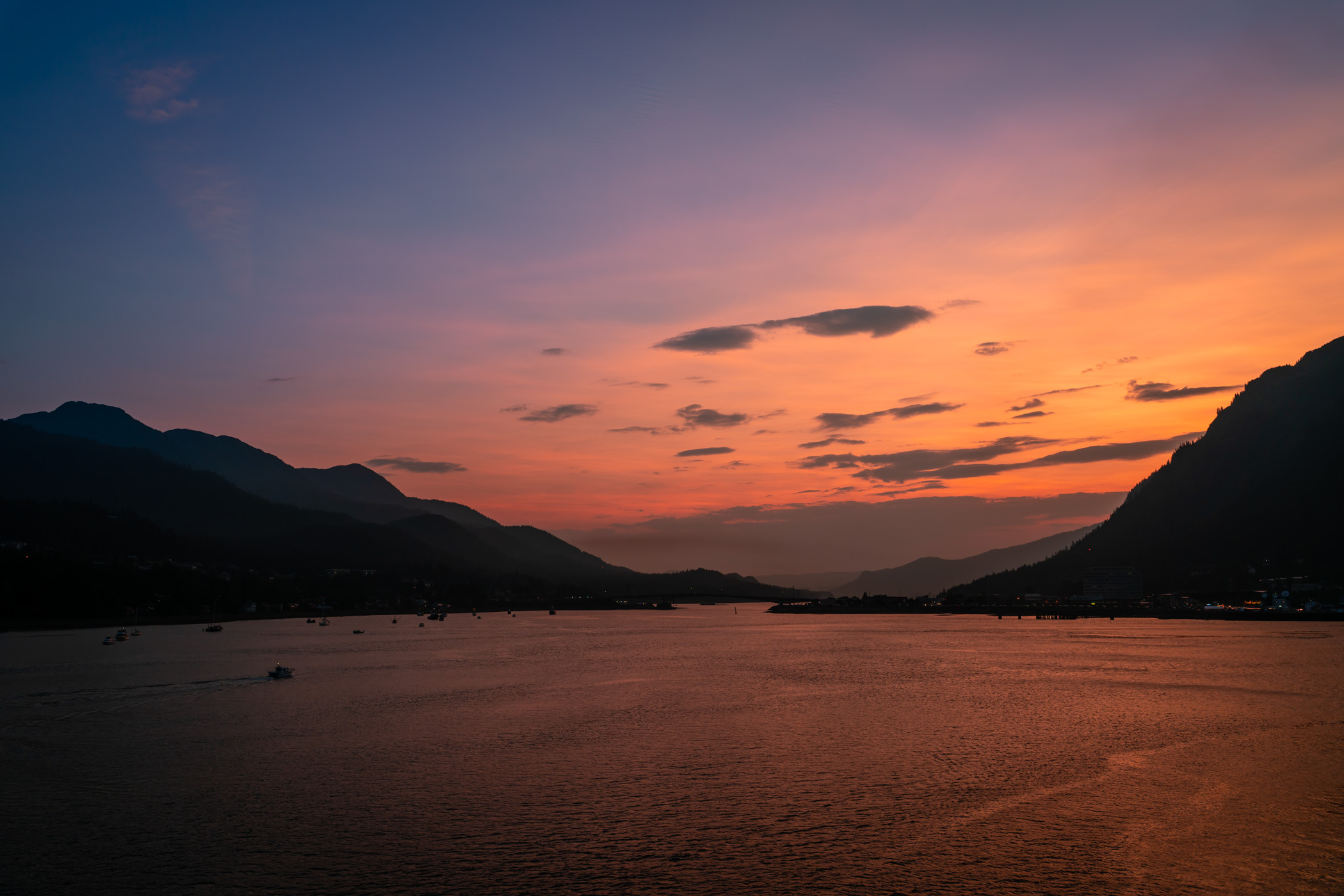 The sun sets on Juneau, Alaska, and the Gastineau Channel.