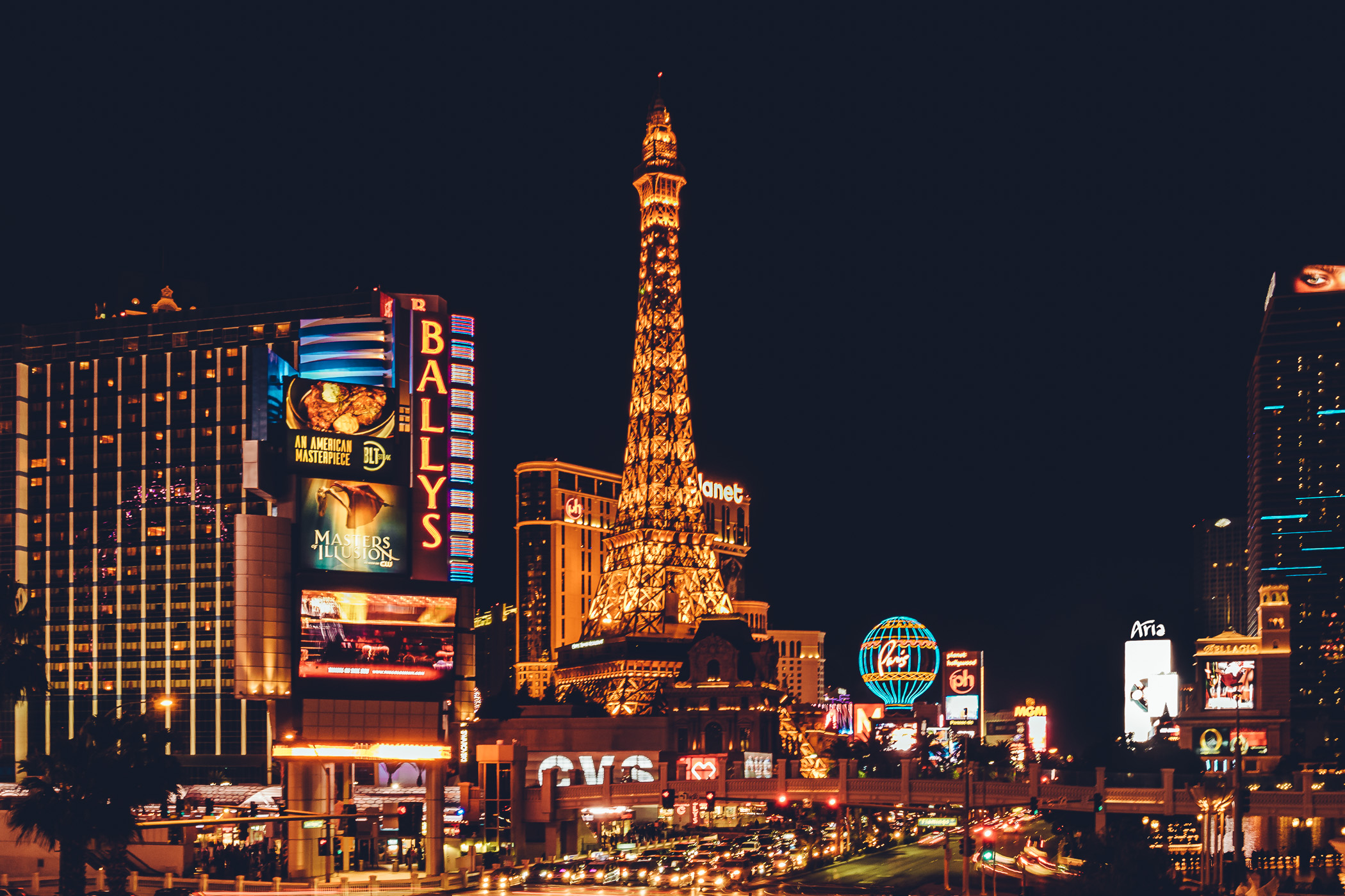 Bally's and Paris Las Vegas glow in the Nevada desert night.