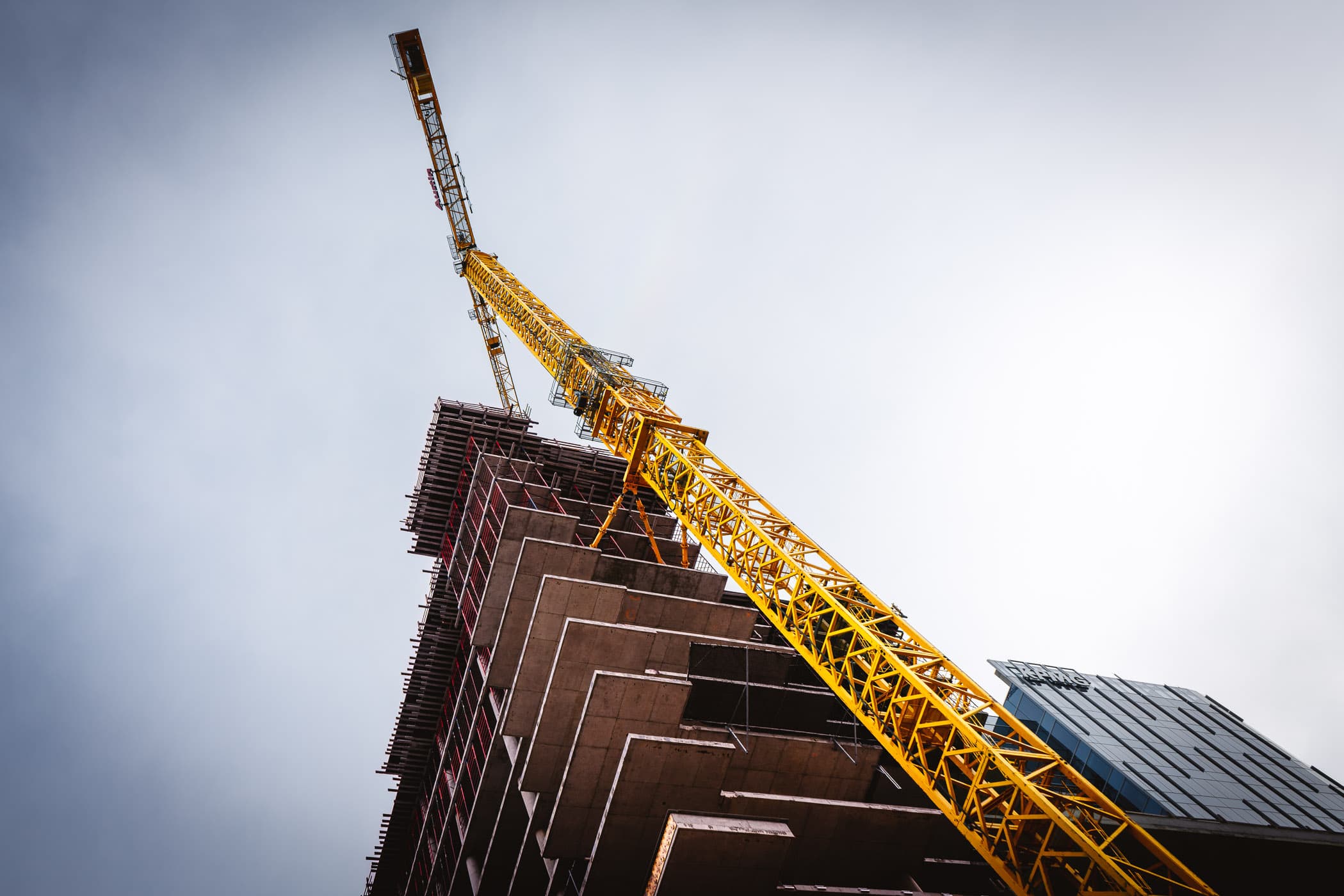 A tower crane at a Downtown Dallas construction site.