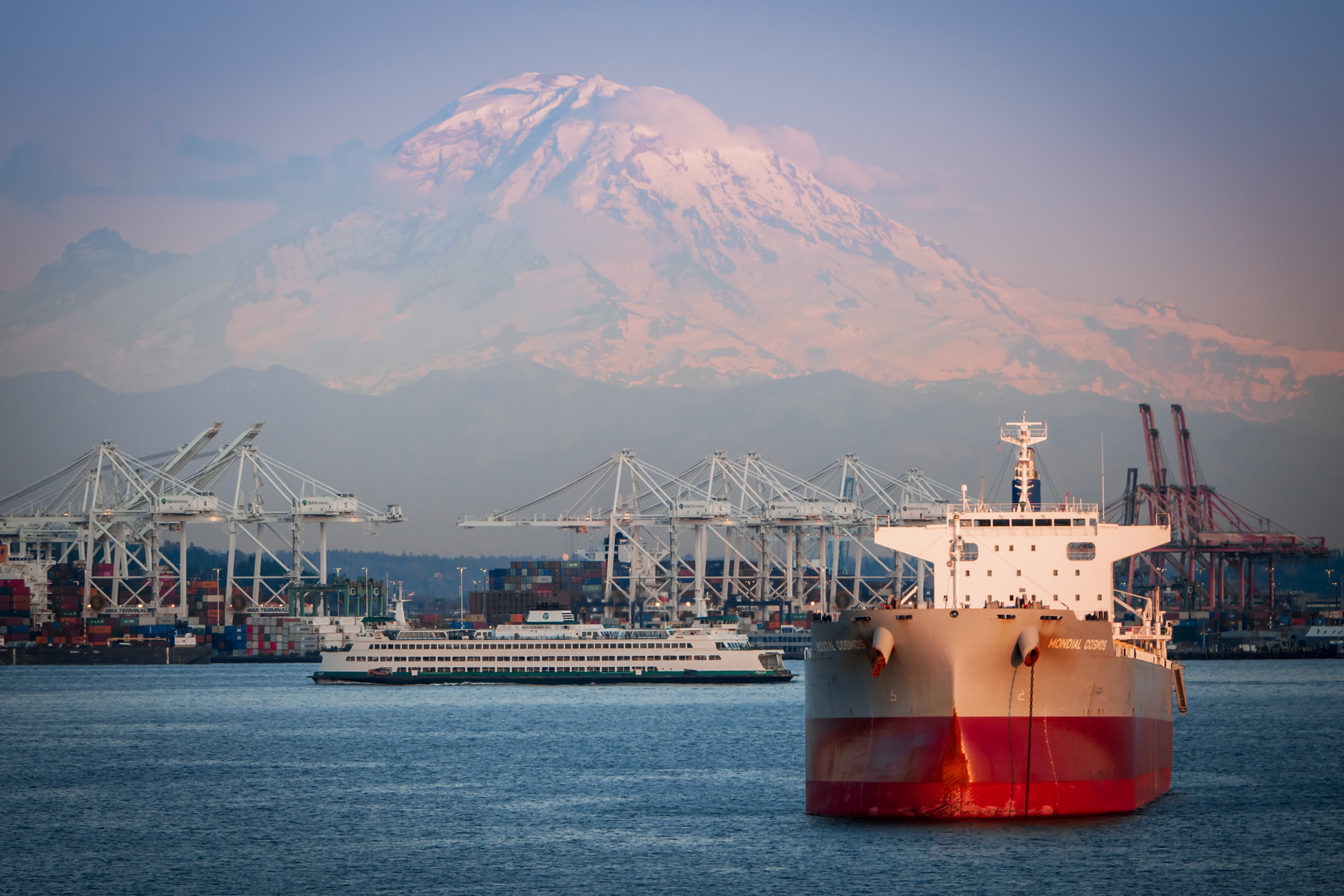 Mount Rainier rises over the Port of Seattle.