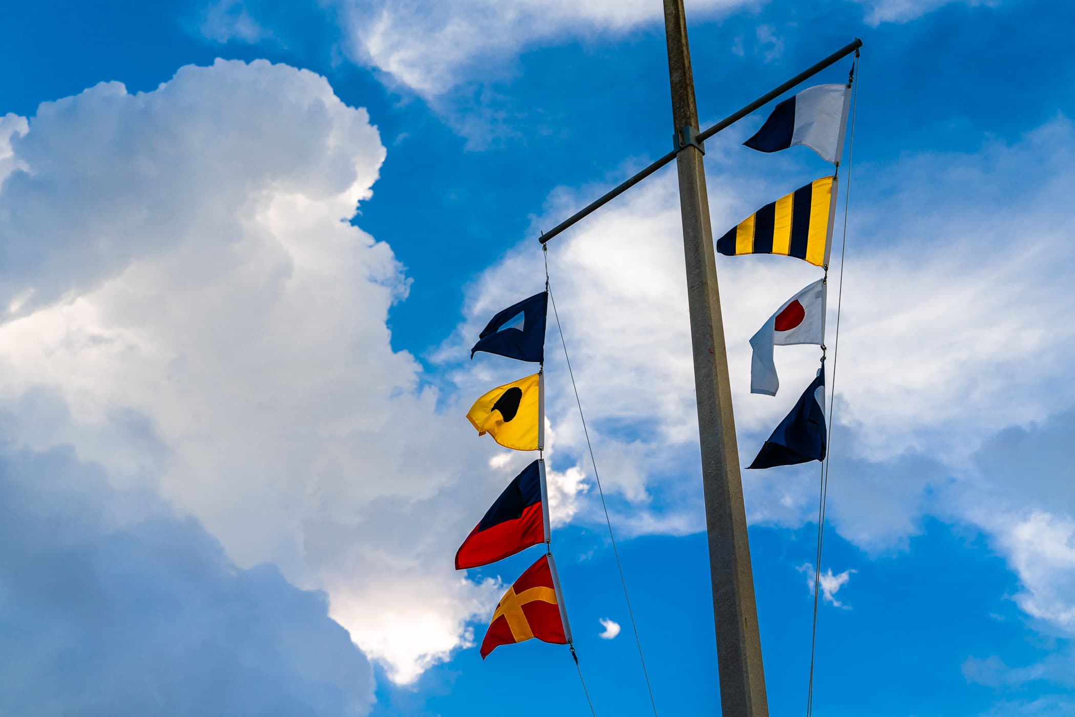 Maritime flags flutter in the breeze in Galveston, Texas.