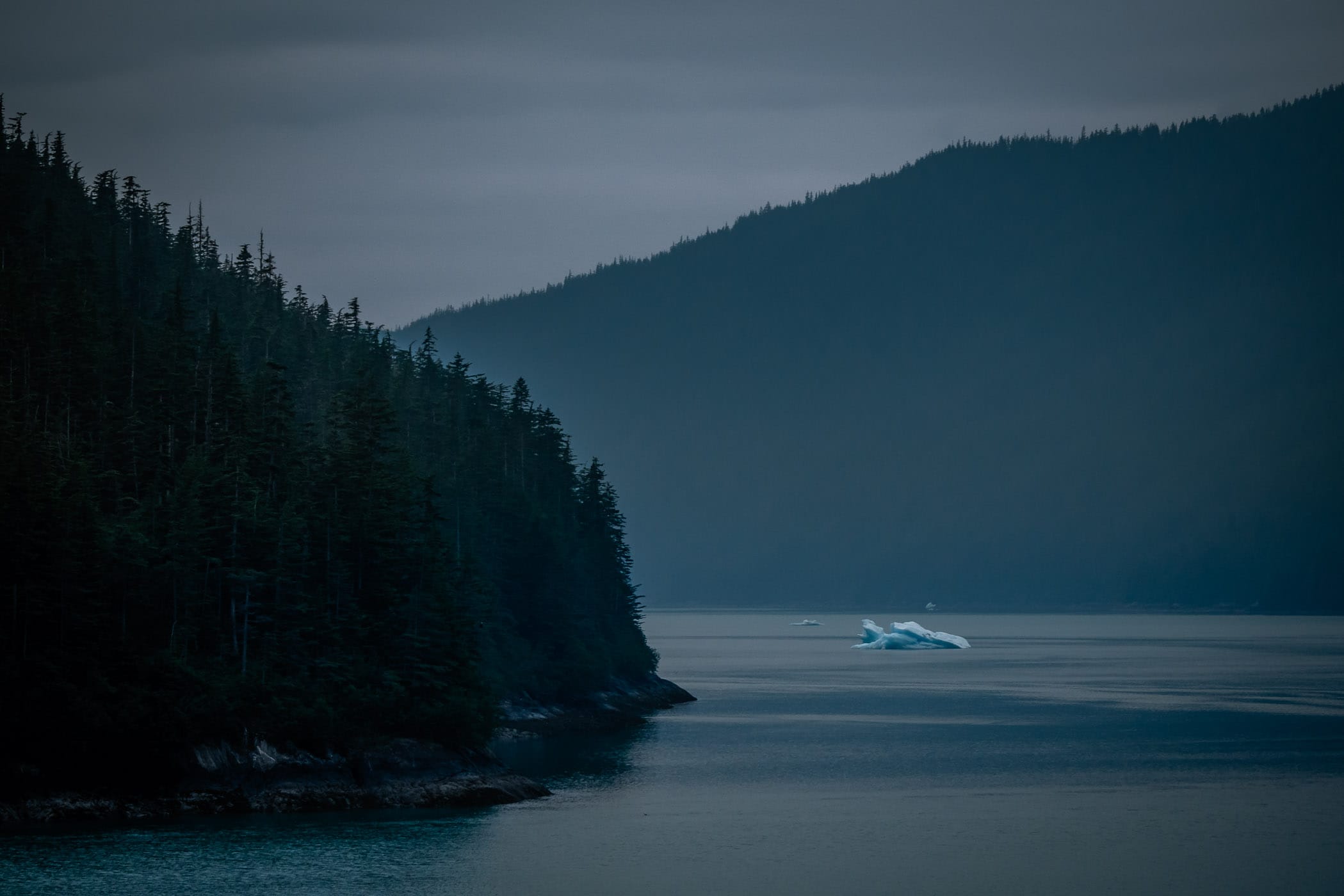 An iceberg floats in Alaska's Stephens Passage near Juneau in the morning twilight.