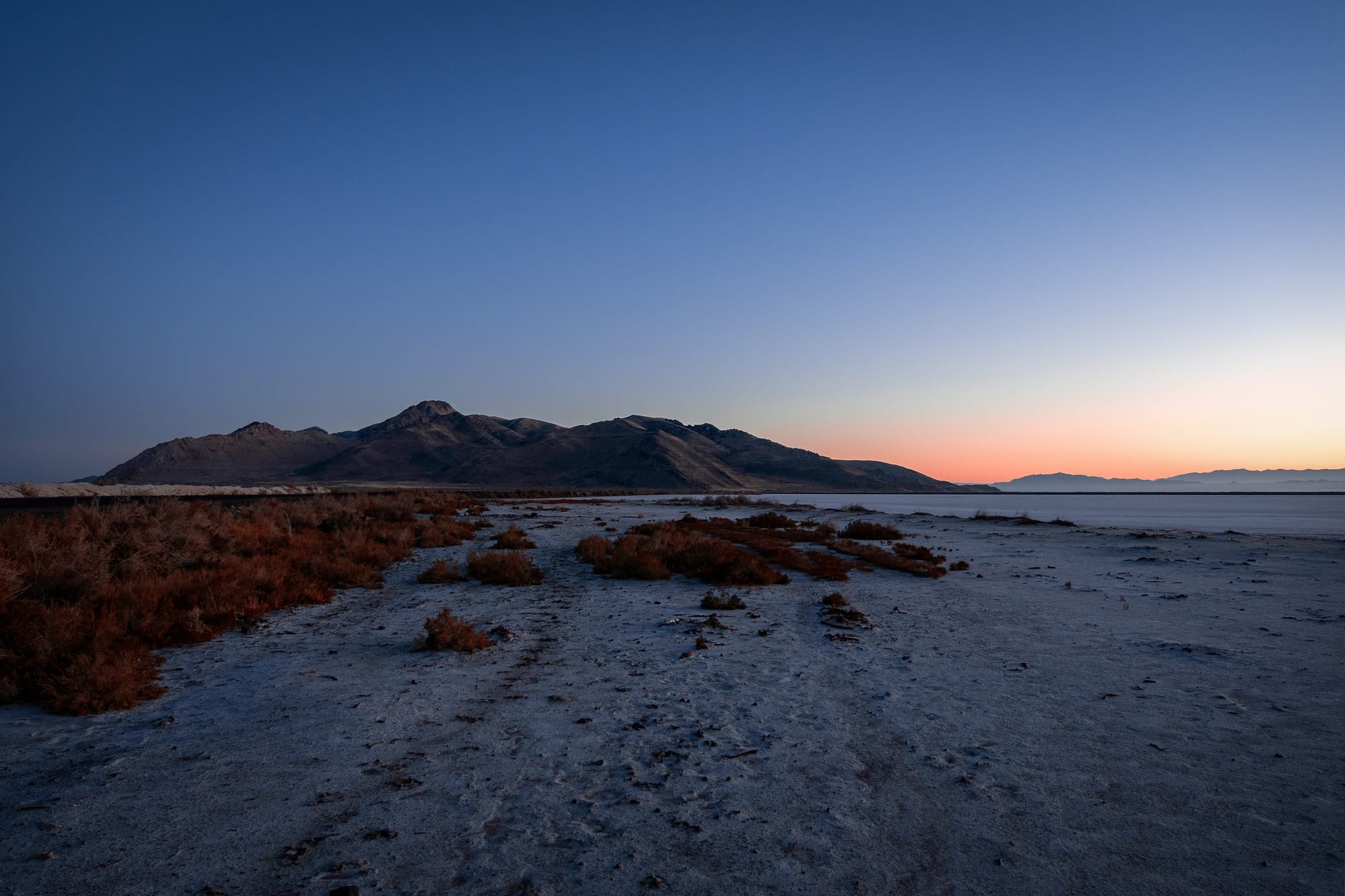 The sun rises on Utah's Stansbury Island along the edge of the Great Salt Lake near Tooele.