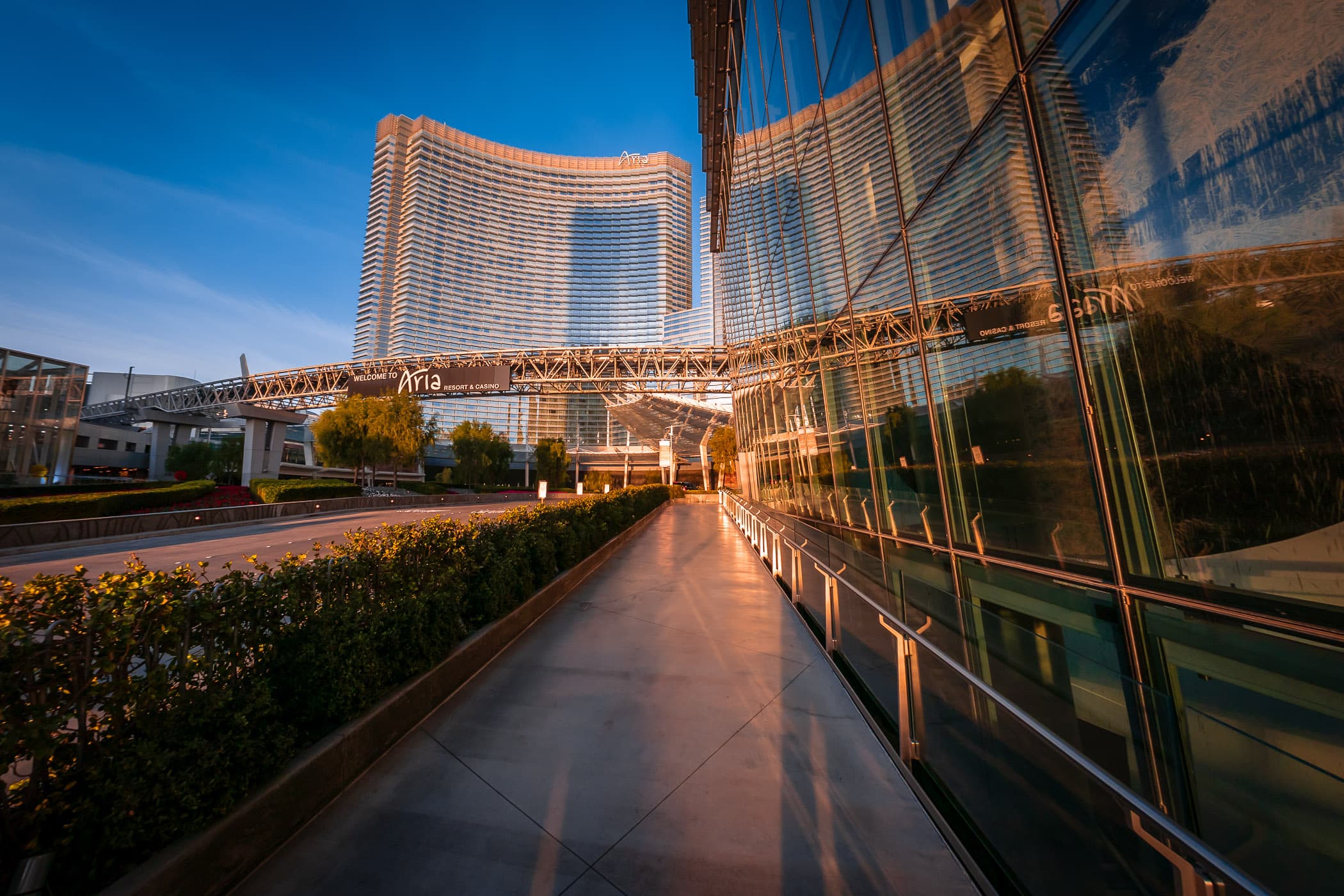 A sidewalk leads past the Veer Towers towards ARIA Resort & Casino at CityCenter, Las Vegas.