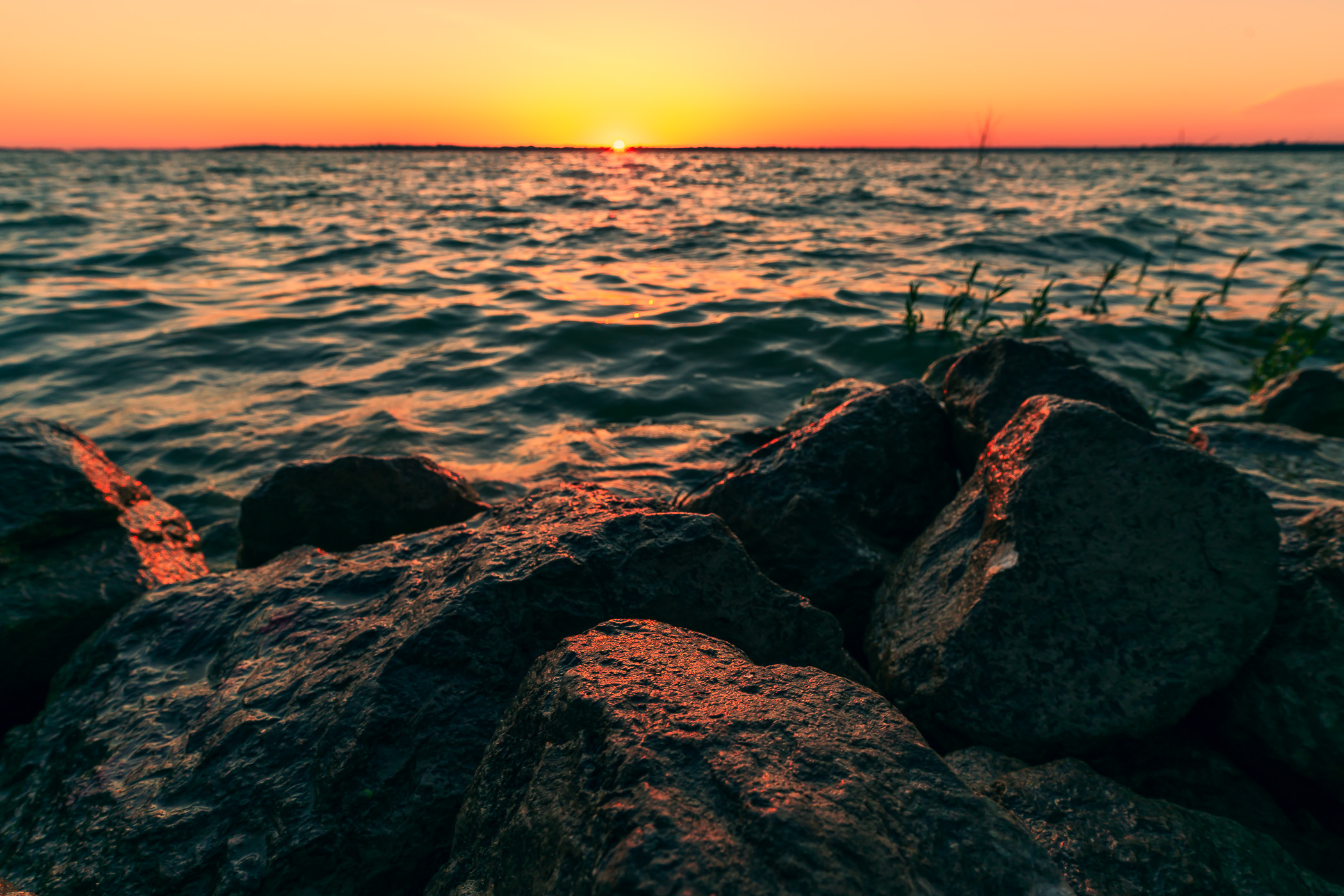 Sunrise along the rocky shore of North Texas' Lake Lavon.