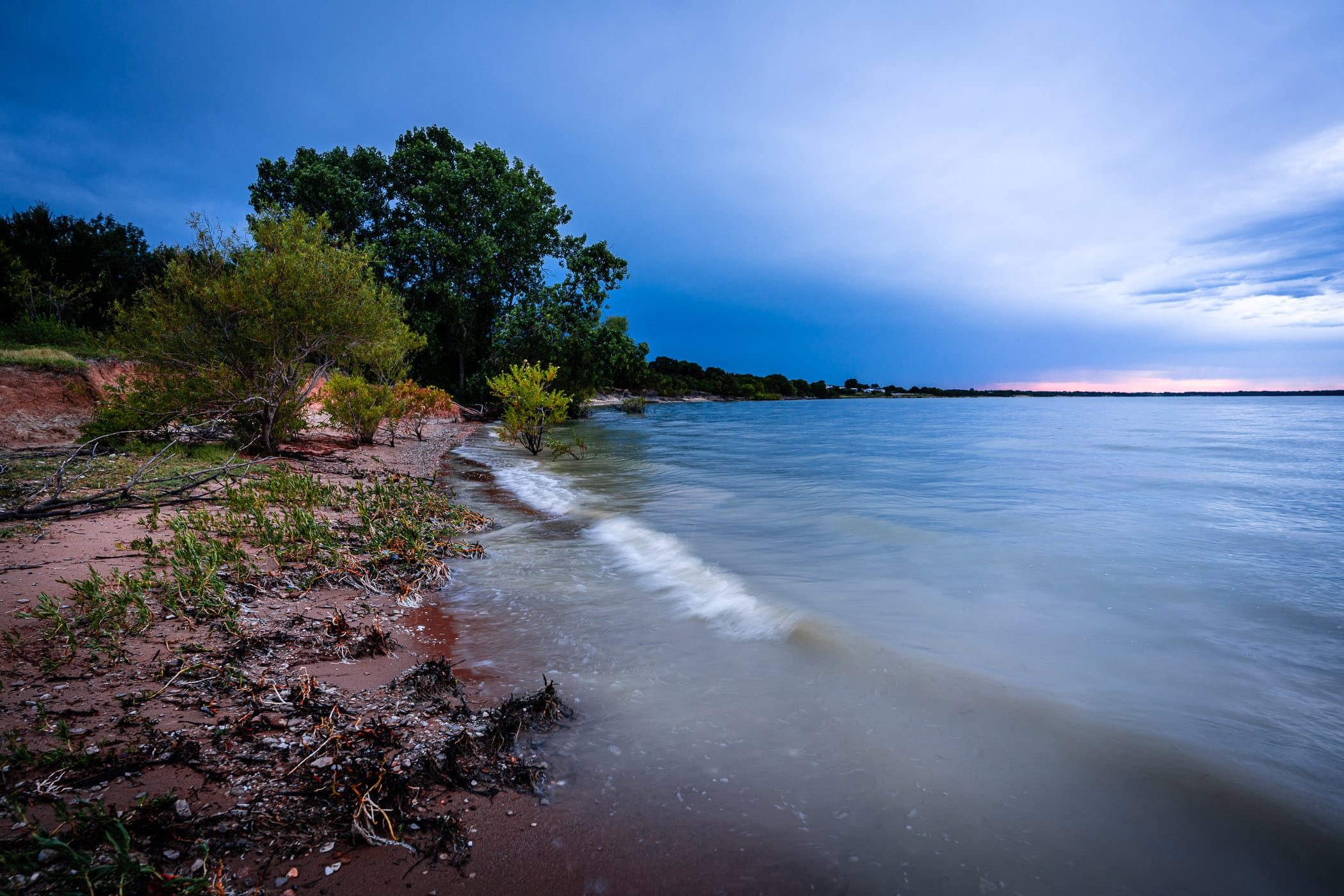 Waves roll onto shore at North Texas' Lake Lavon.