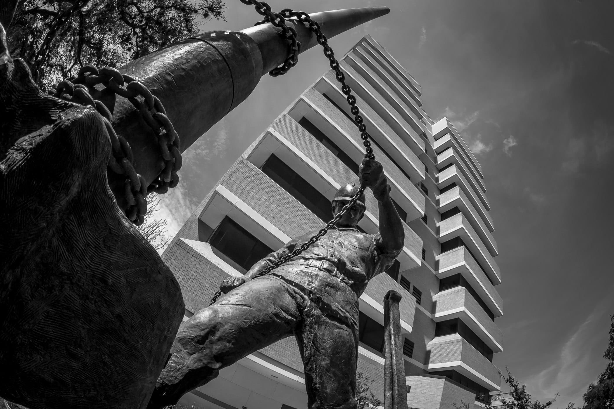 A sculpture of an oilfield worker by noted sculptor Rosie Sandifer outside the Joe C. Richardson Petroleum Engineering Building at Texas A&M University.