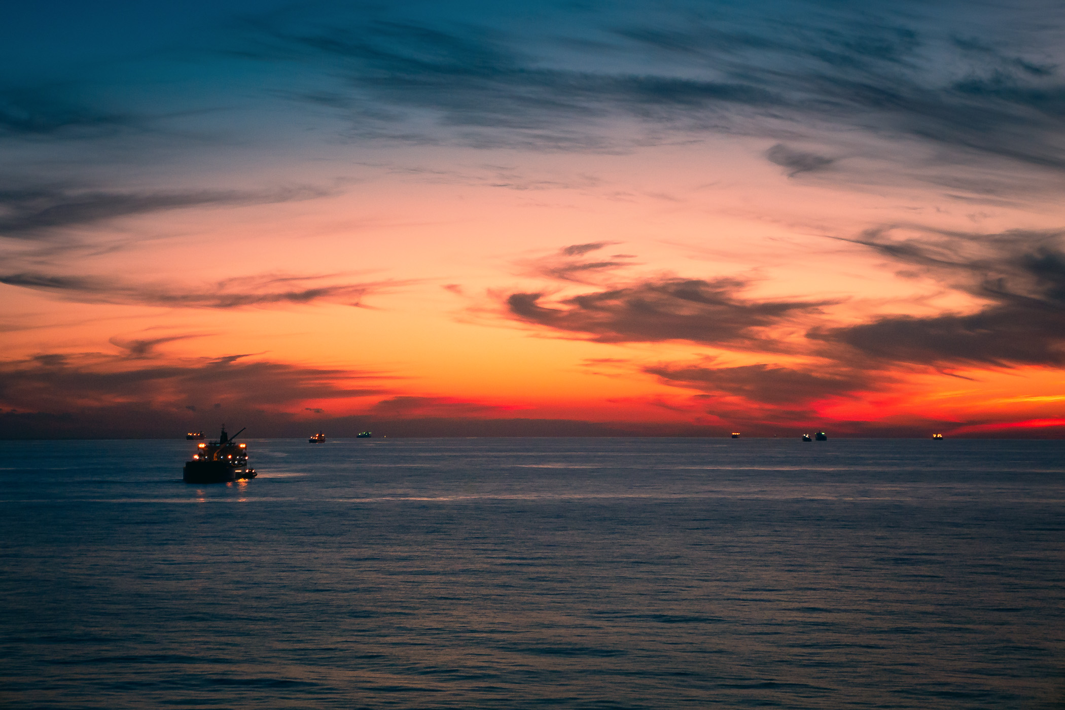 Ships await entry into the Port of Houston at the Bolivar Roads Anchorage off the coast of Galveston, Texas.