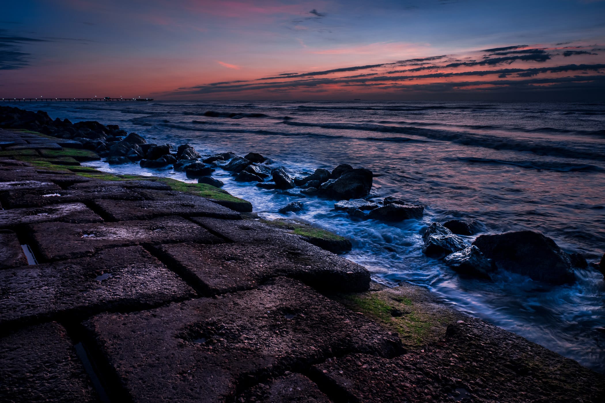 Granite blocks at the base of the Galveston, Texas, seawall are pounded by the Gulf of Mexico surf.