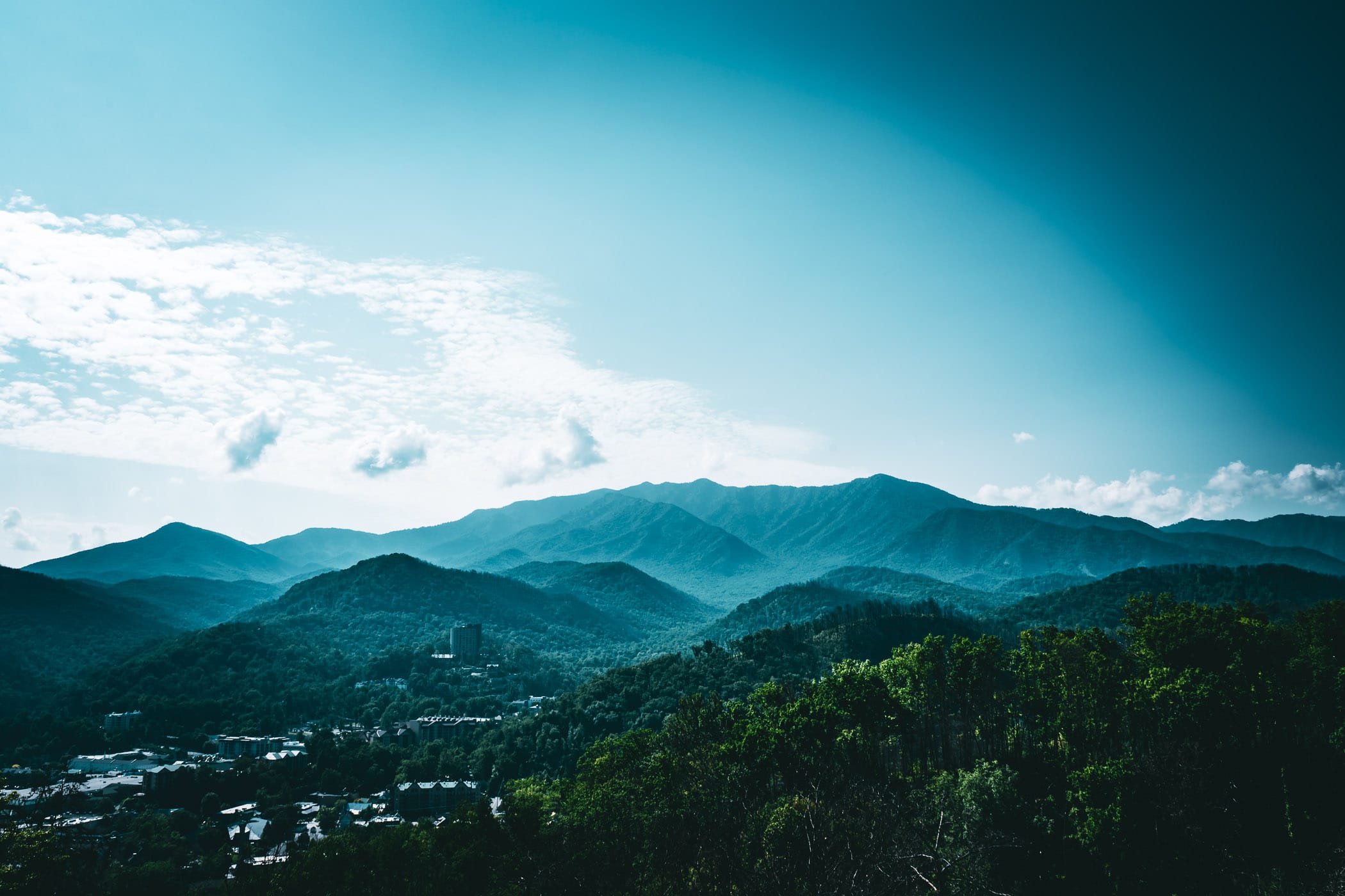 Gatlinburg, Tennessee, nestled in the hazy Great Smoky Mountains.