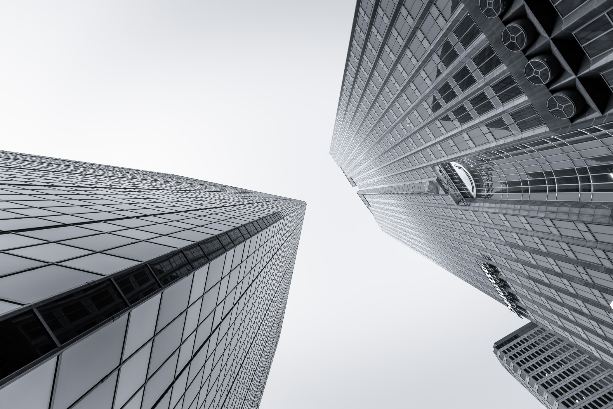 Dallas Arts Tower (formerly Chase Tower) and the adjacent north tower of the Plaza of the Americas in Downtown Dallas.