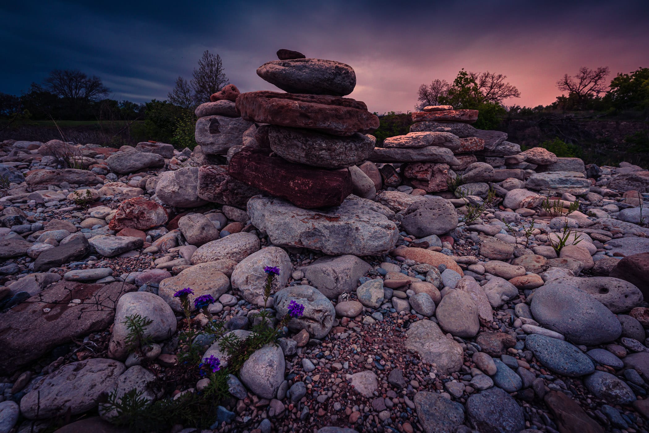 A stack of river stones along the shore of the Llano River near Mason, Texas.