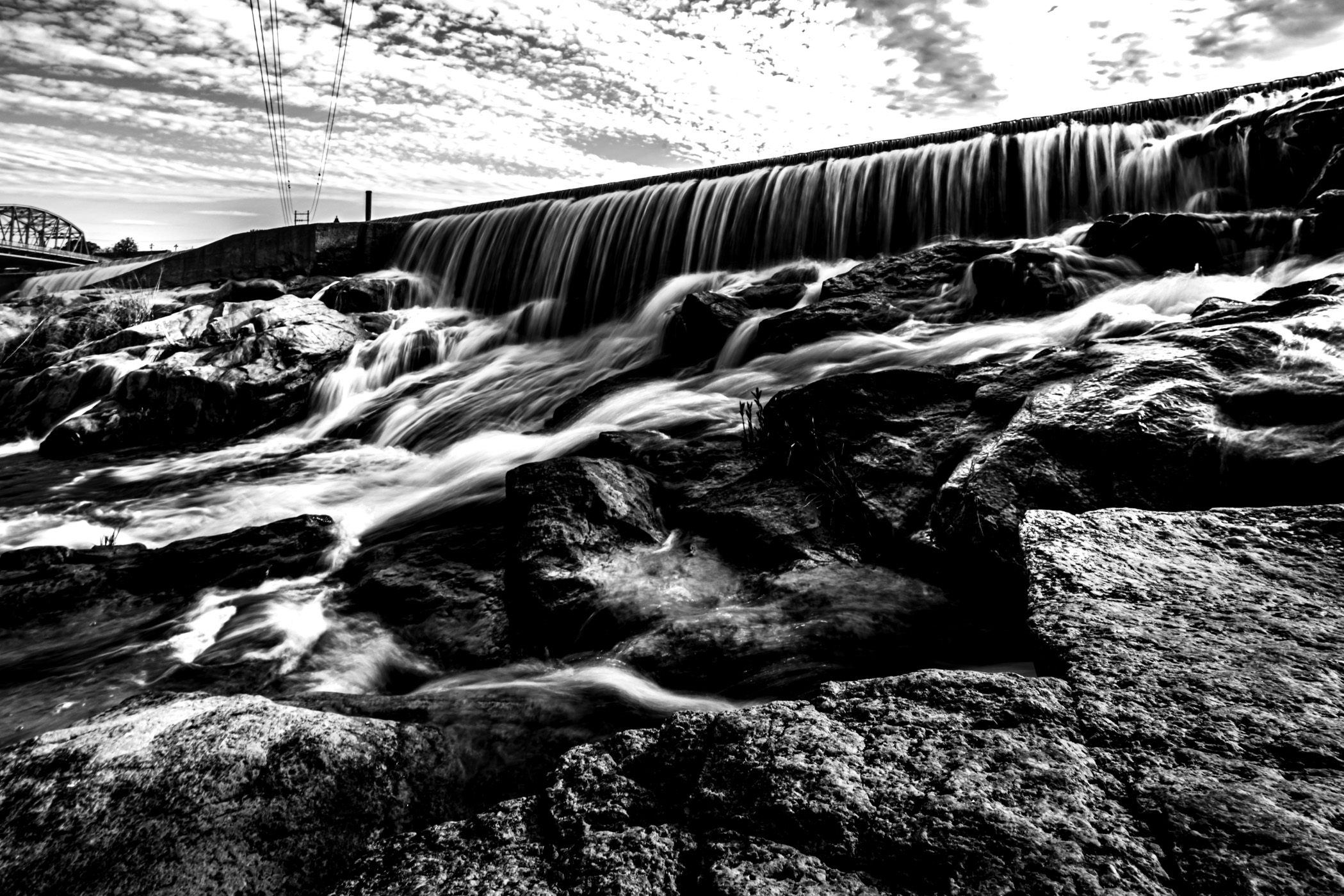 The Llano River flows over a small dam in Llano, Texas.