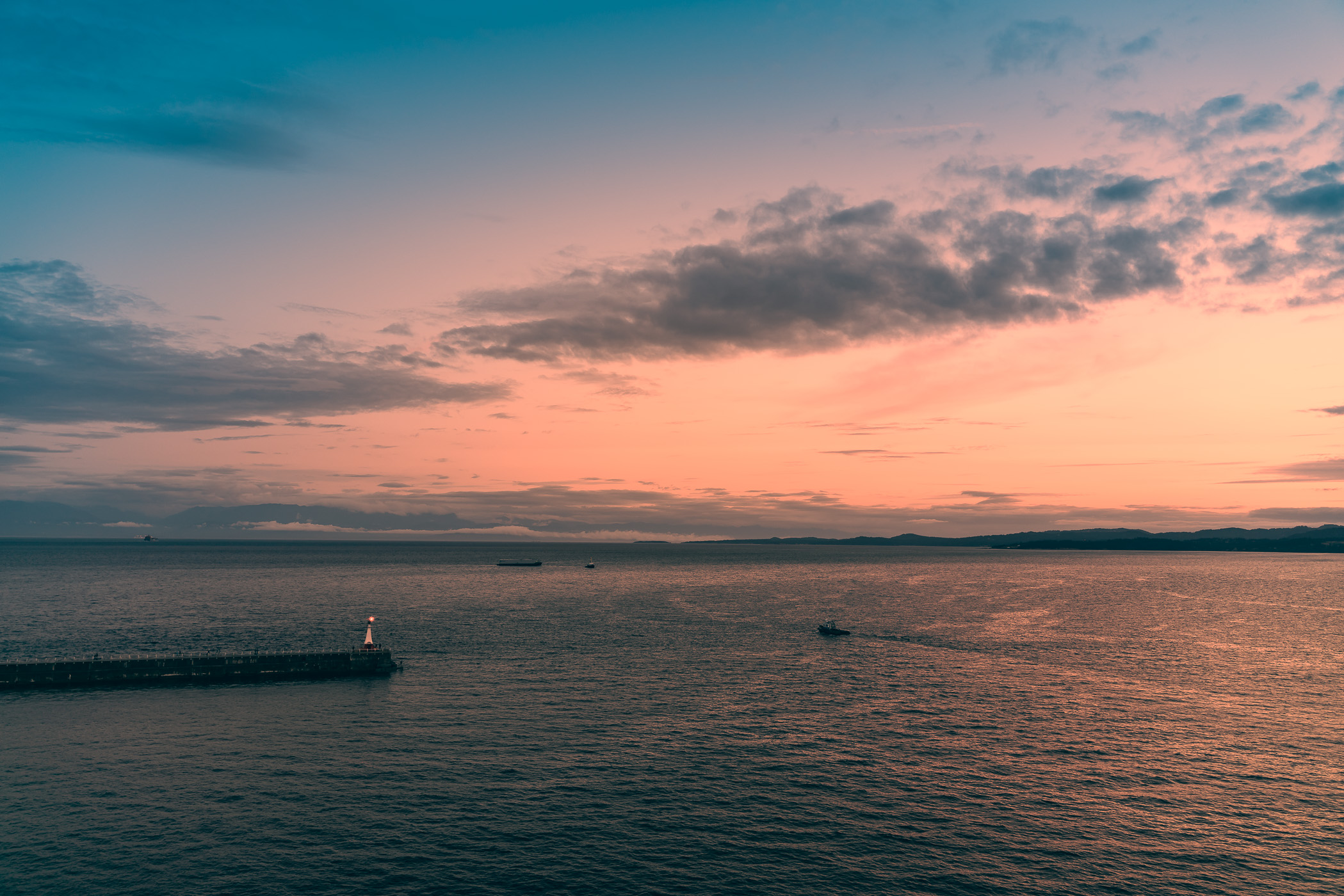 The sun sets on the mouth of Victoria Harbour, Victoria, British Columbia.