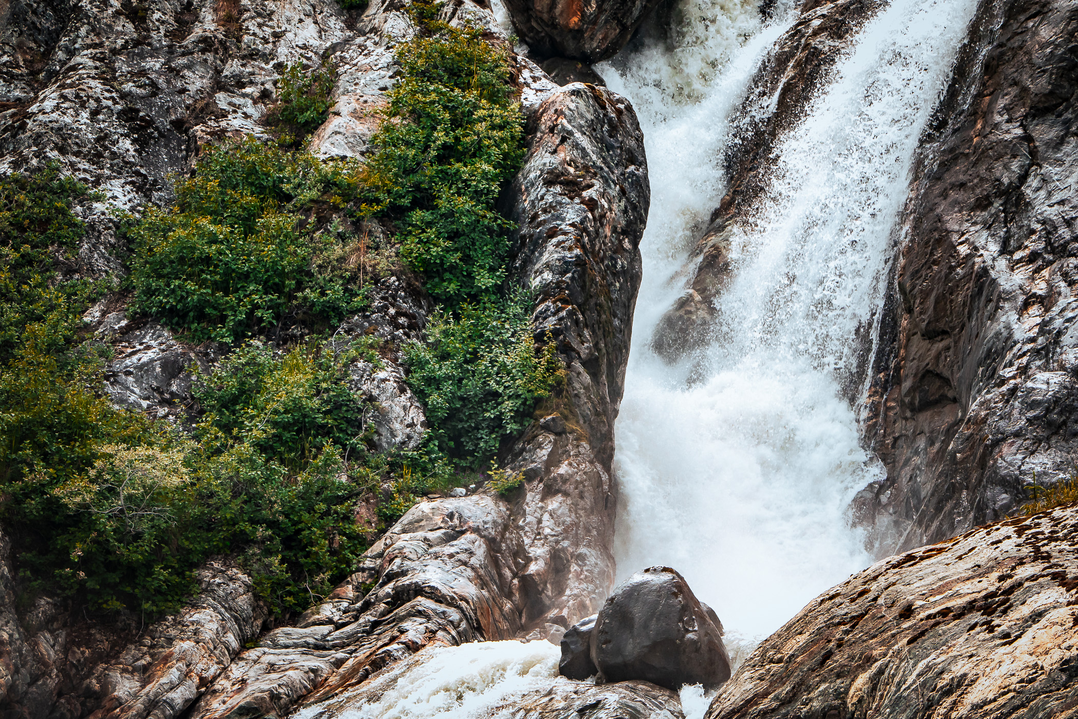 A waterfall along the rocky cliffs along Alaska's Tracy Arm Fjord.